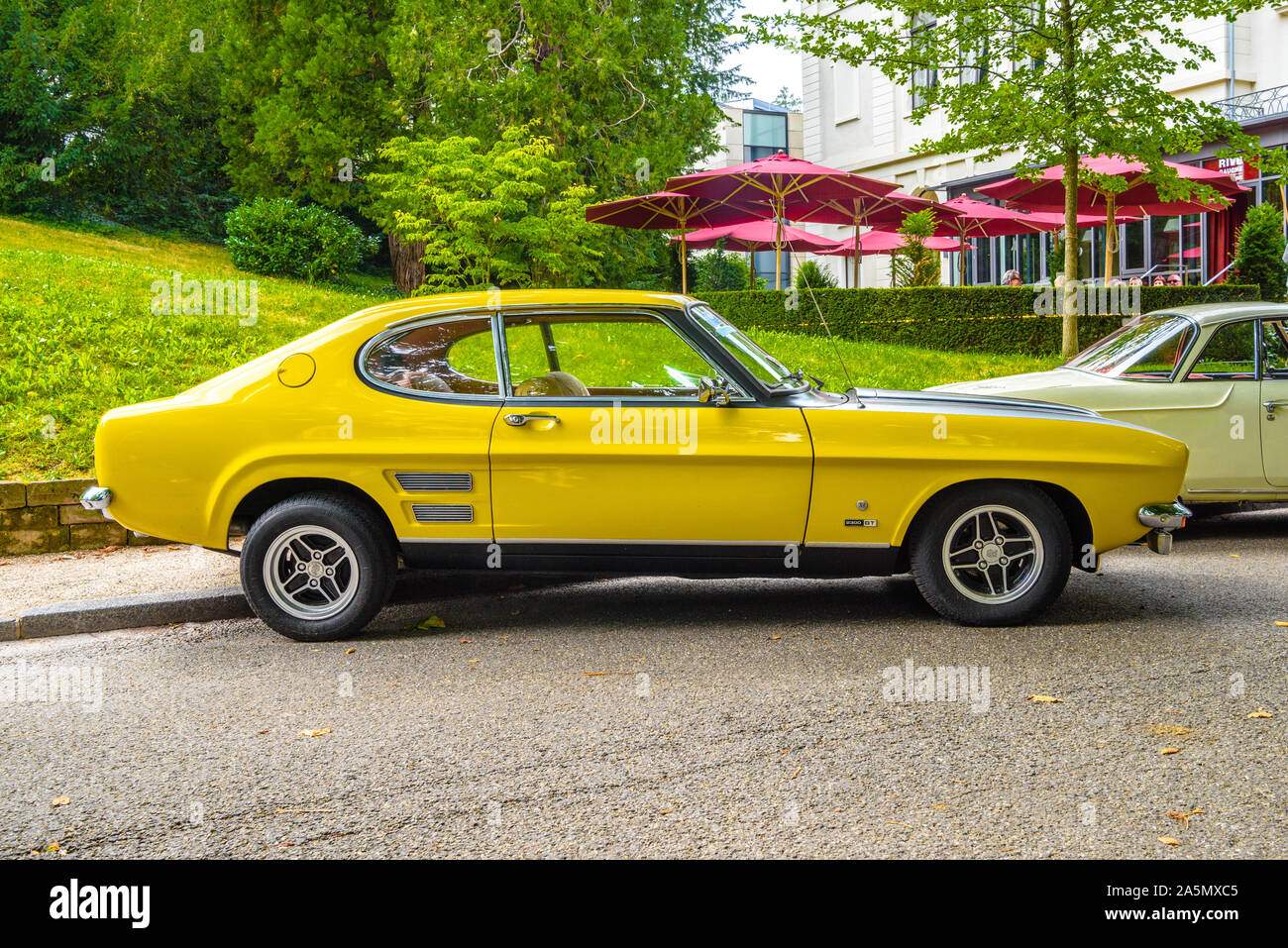 BADEN BADEN, GERMANY - JULY 2019: yellow black FORD CAPRI MK I 2800 1969 1974 sport coupe, oldtimer meeting in Kurpark. Stock Photo