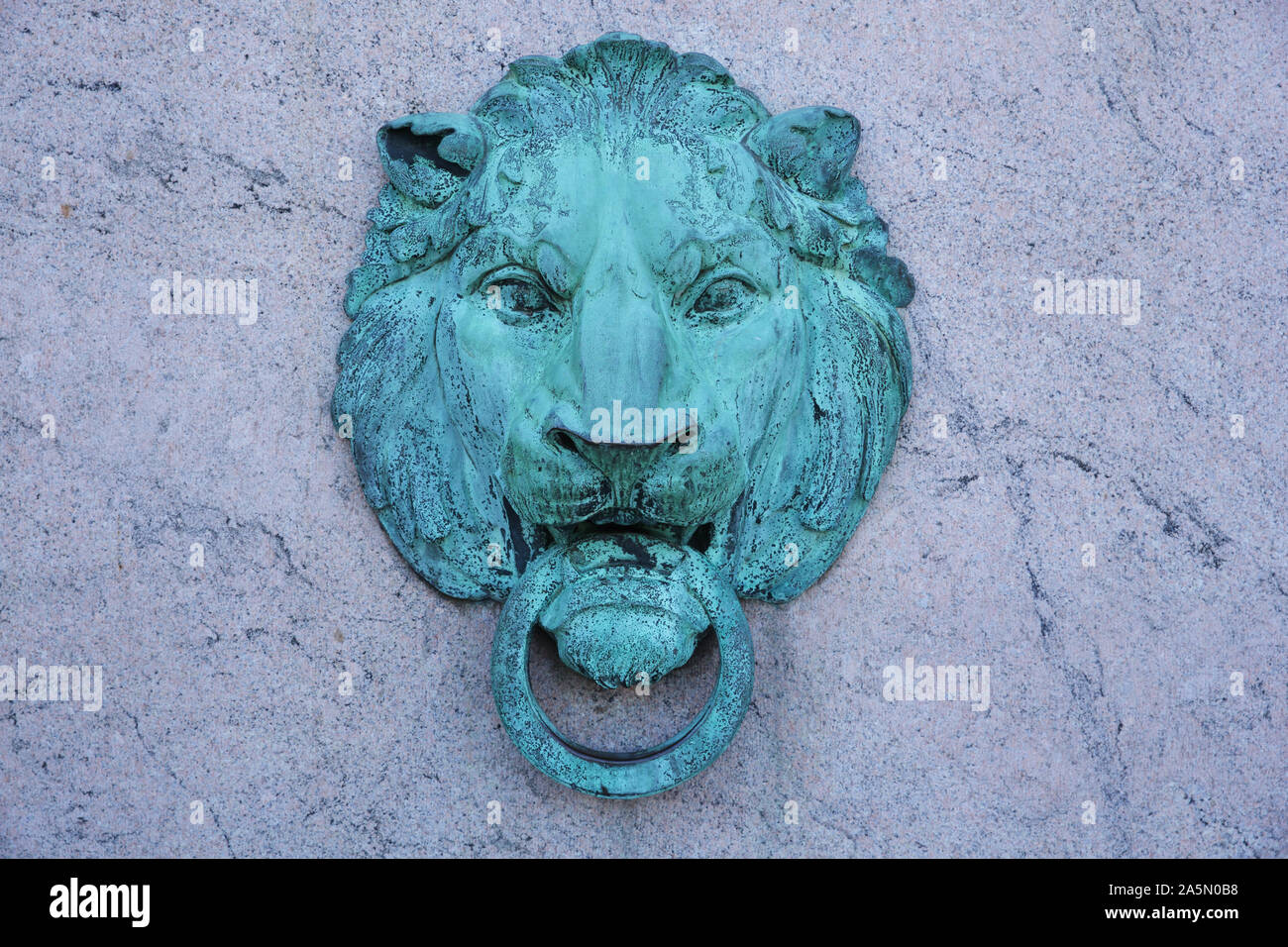 Columbia University campus in Morningside Heights, New York, USA. Bronze lion head outside the Butler Library. Stock Photo