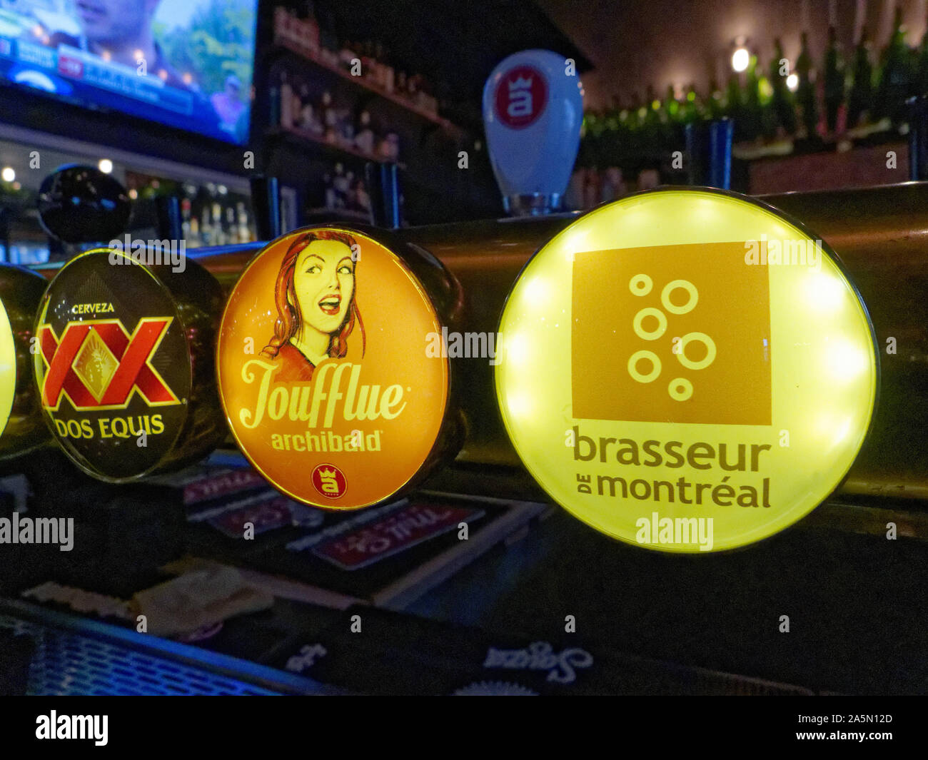 Locally brewed beers on tap in a bar in Quebec Stock Photo