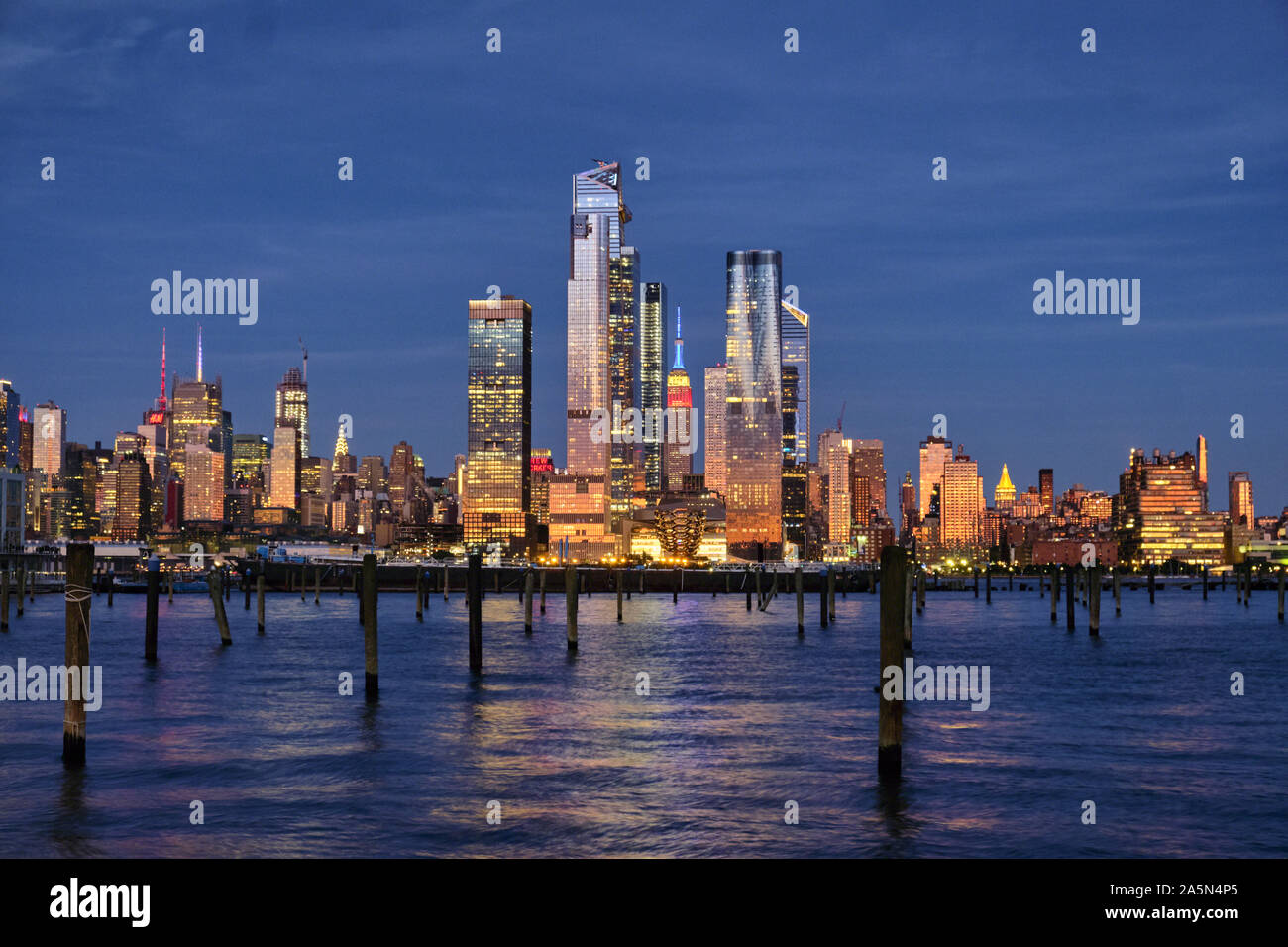 Buildings of Midtown Manhattan Illuminated at Night as Viewed from Weehawken, New Jersey Stock Photo