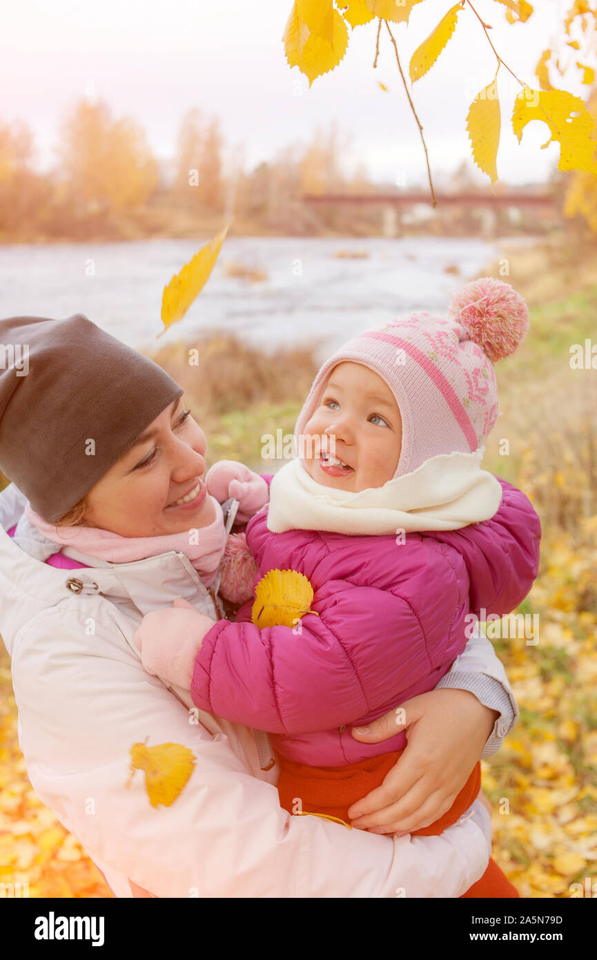 Portrait of mother and cute daughter hugging outdoors. Healthy lifestyle. Family outdoor. Autumn fall season. Autumn nature. Happy childhood. Healthy Stock Photo