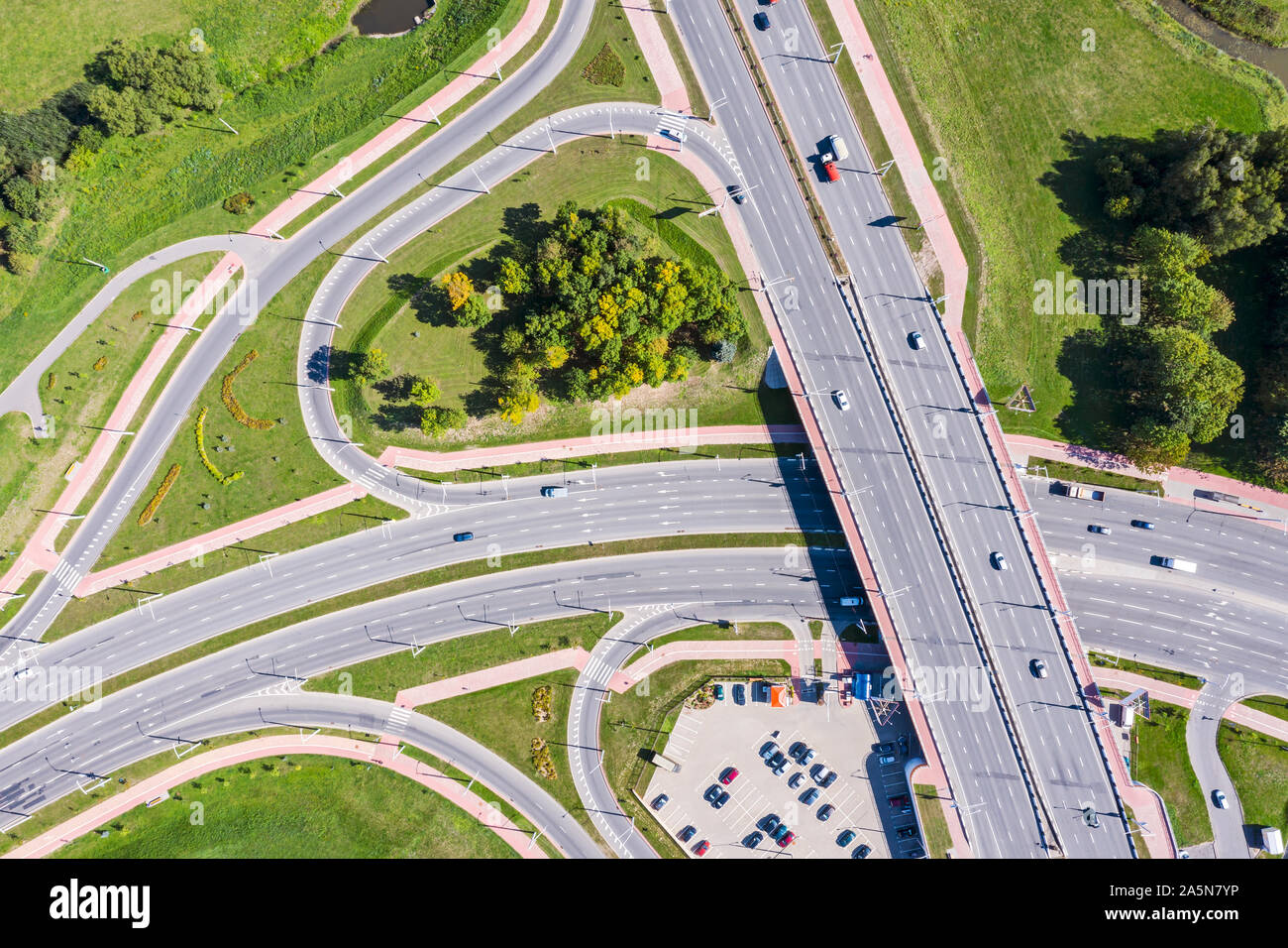 aerial top view of asphalt road intersection. city highway in sunny day ...