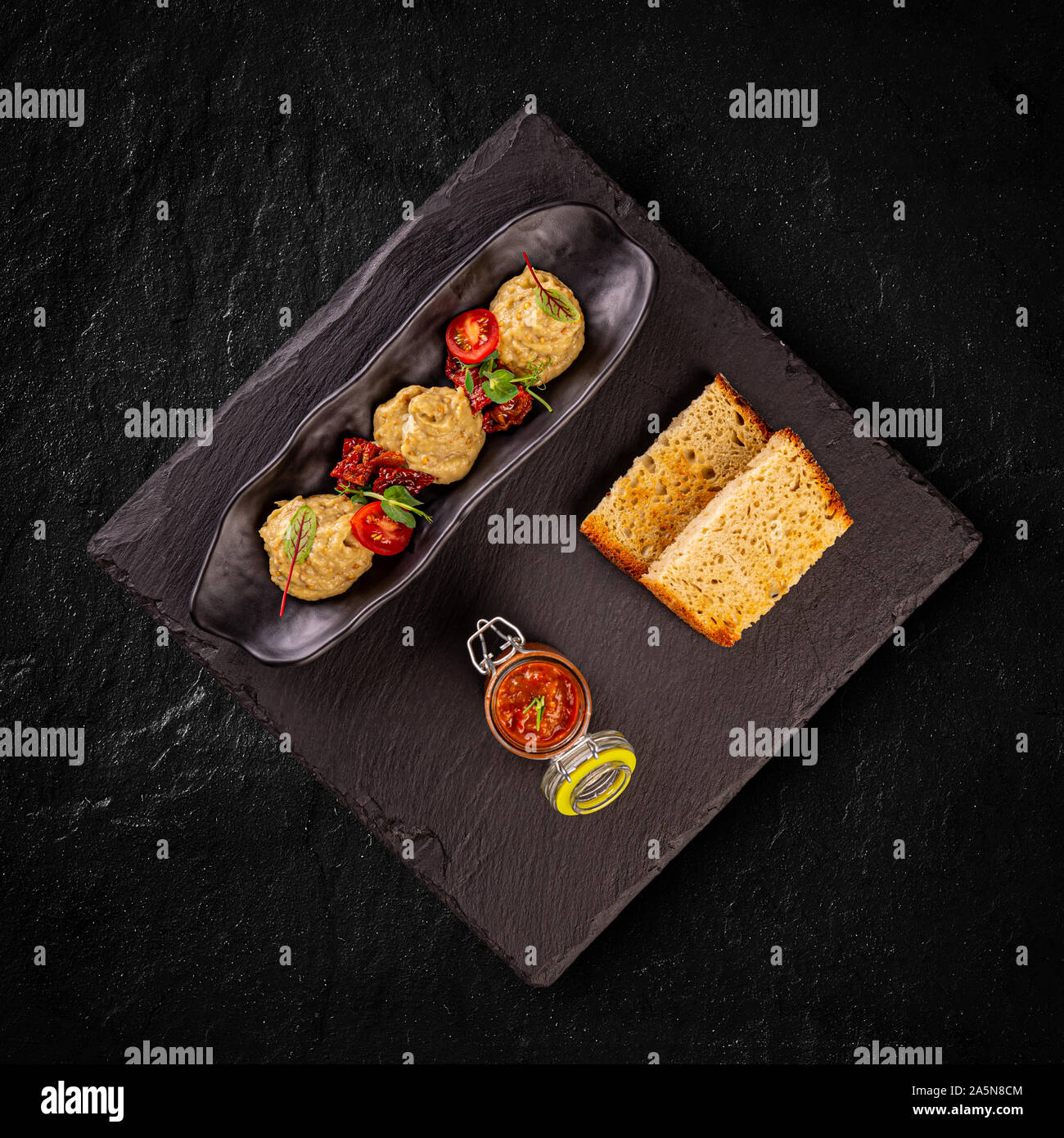 Transylvanian vegetable spread named zacusca and eggplant cream with truffle Stock Photo