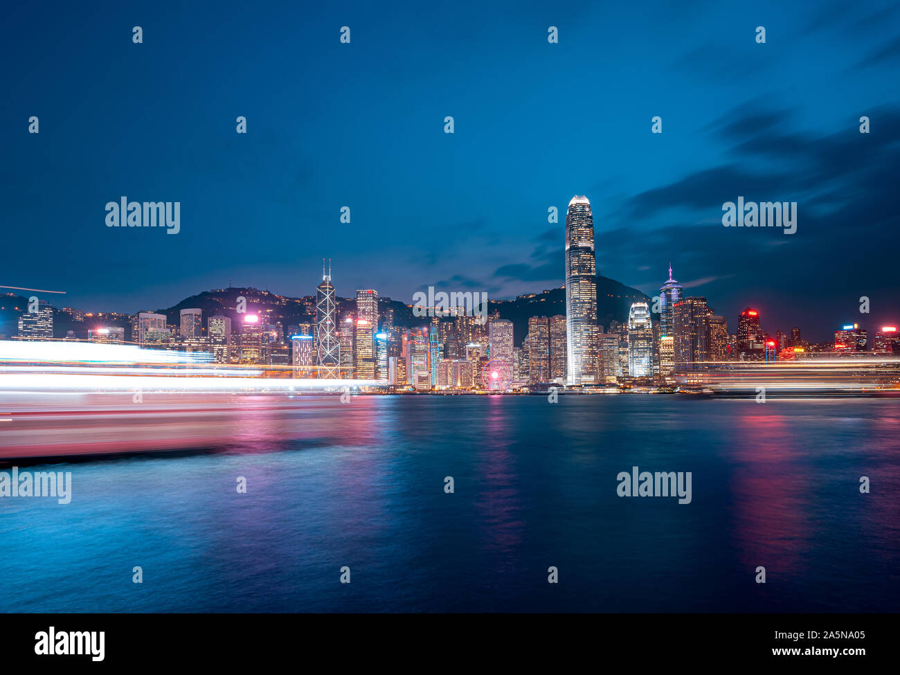 Cityscape and skyline at Victoria Harbour in Hong Kong city at Night ...
