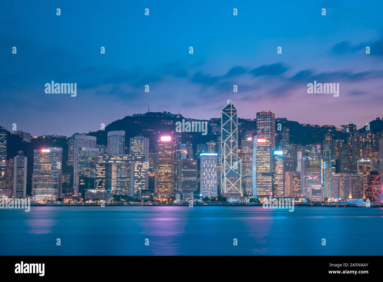 Cityscape and skyline at Victoria Harbour in Hong Kong city at Night ...