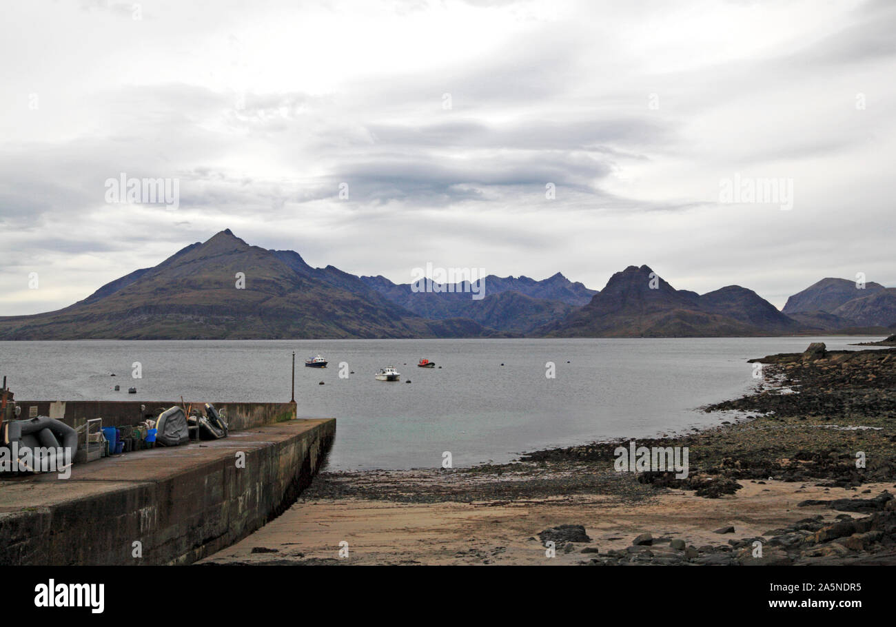 A view from the beach and jetty to the Cuillin Hills across Loch Scavaig at Elgol, Strathaird, Isle of Skye, Scotland, United Kingdom, Europe. Stock Photo