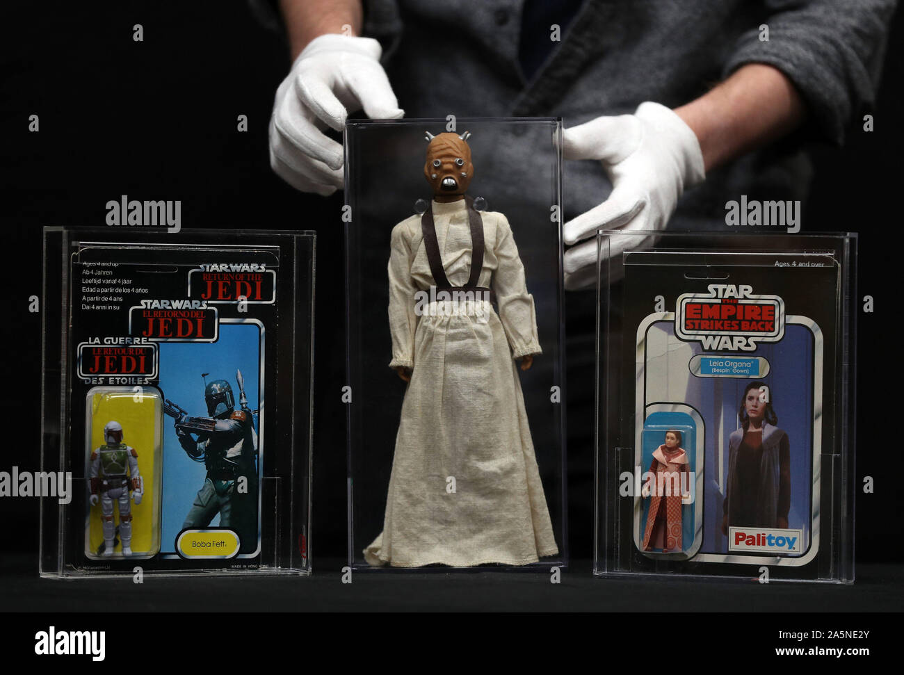 (left to right) A Boba Fett ROTJ Tri-Logo figure from the film Star Wars: Return of the Jedi (estimate ??2000 - ??3000), a Tusken Raider large size Action Figure from the film Star Wars: A New Hope (estimate ??1000 - ??1500), and a Princess Leia (Bespin Gown) ESB 30 Back-B figure from the film Star Wars:The Empire Strikes Back (estimate ??4000 - ??6000), during a preview for the Prop Store's forthcoming cinema poster live auction. Stock Photo