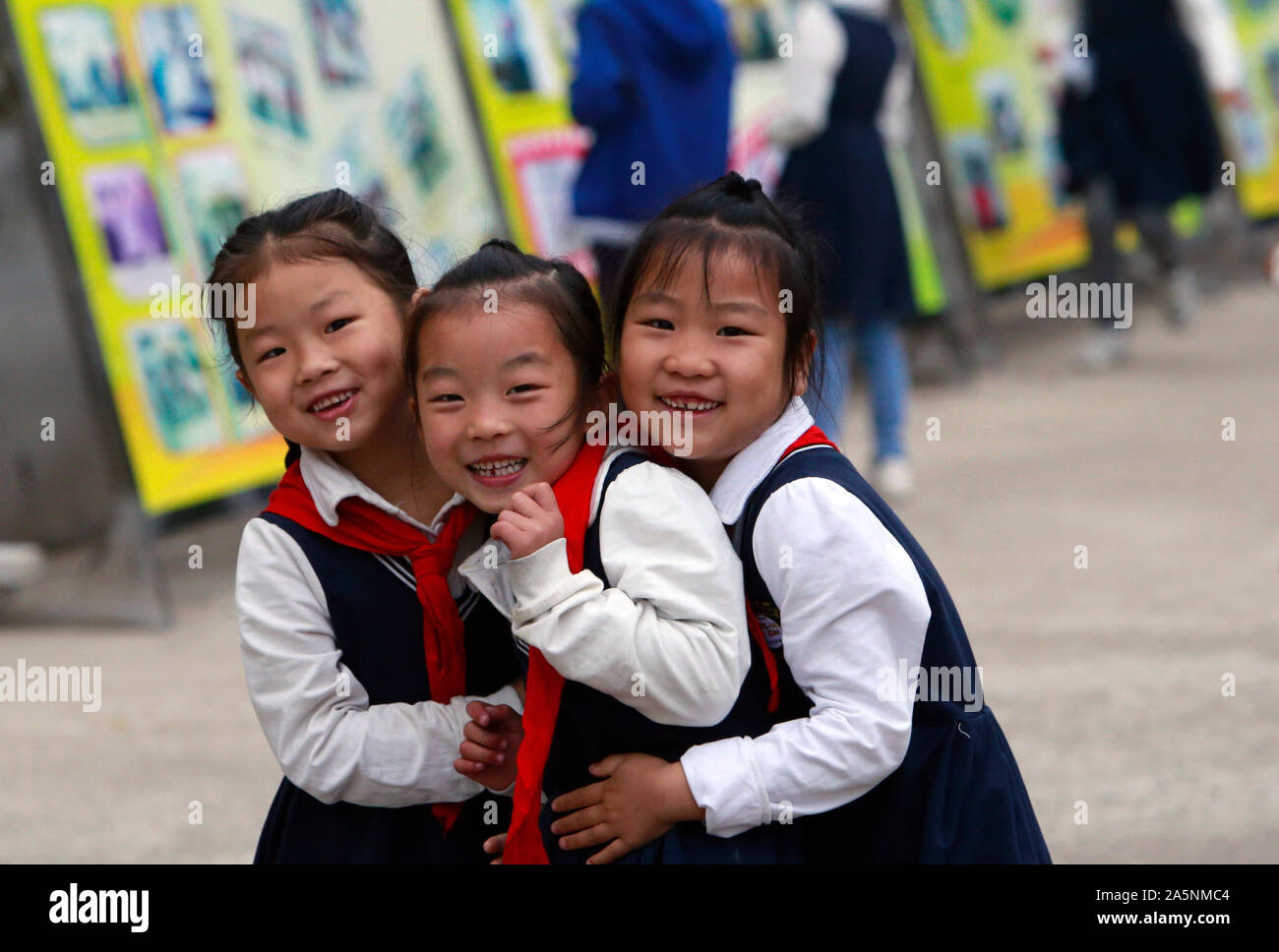 (191022) -- LUOTIAN, Oct. 22, 2019 (Xinhua) -- Students play during class break at Hope primary School in Luotian County, central China's Hubei Province, Oct. 11, 2019. Fang Rong, 29, is the headmaster of Hope primary school of Luotian County, her alma mater. Born in a poverty-stricken region, Fang Rong was a left-behind girl. Thanks to the Hope Project and people's aids, she succeeded in graduating from a secondary normal school. To help more children and repay people's kindness, she decided to be a teacher at her alma mater. In spite of the austere way of life, Fang shouldered her respo Stock Photo