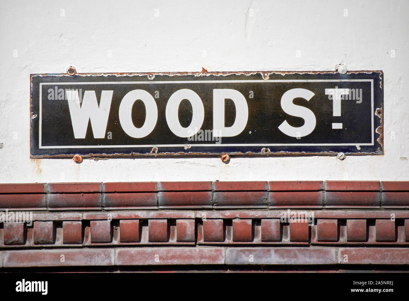 old worn metal street sign for wood street in Port Sunlight England UK Stock Photo
