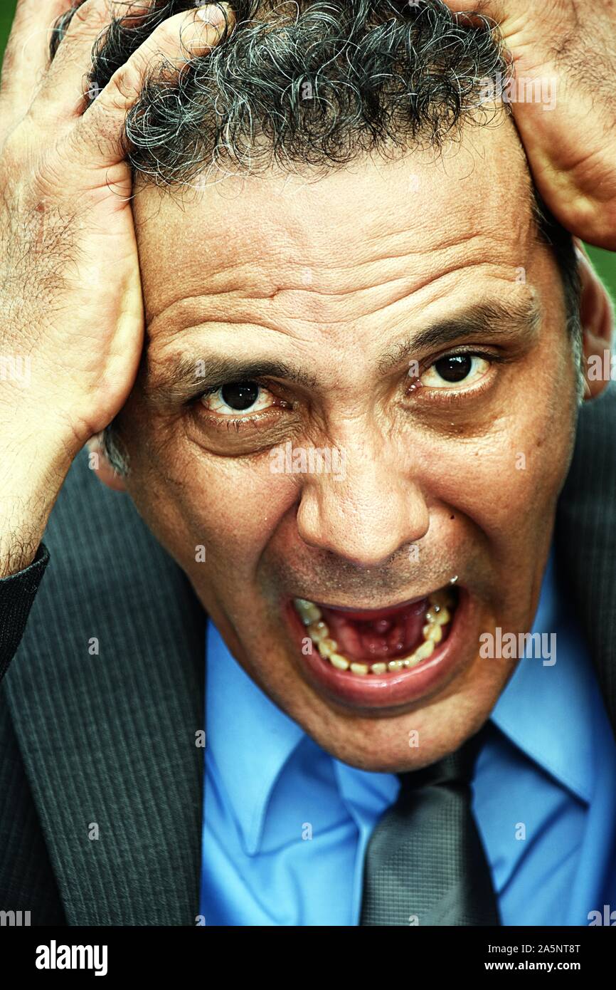 Stressful Hispanic Businessman Stock Photo