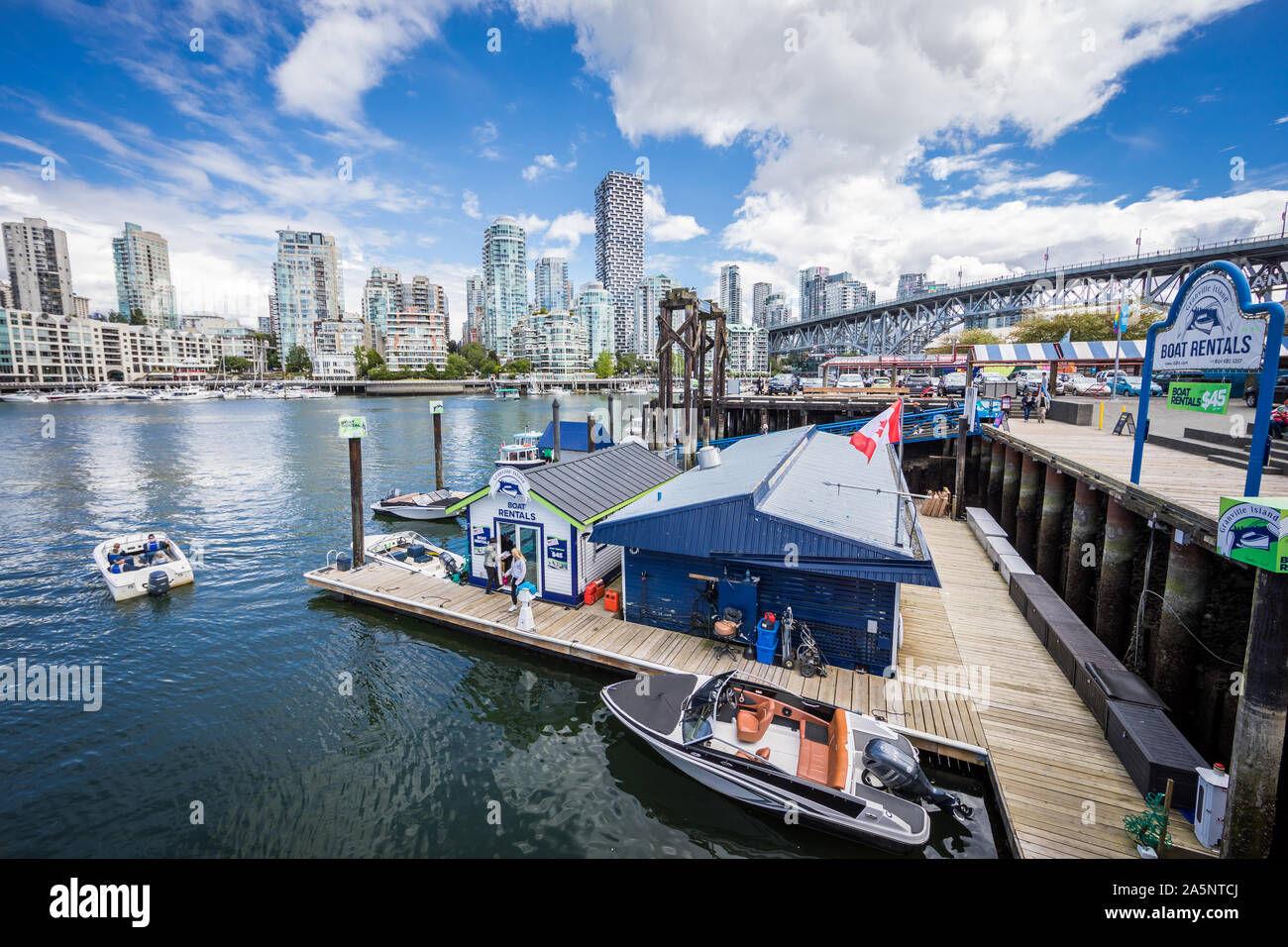 View of Ferry Dock at Granville Island with Vancouver Skyline in the