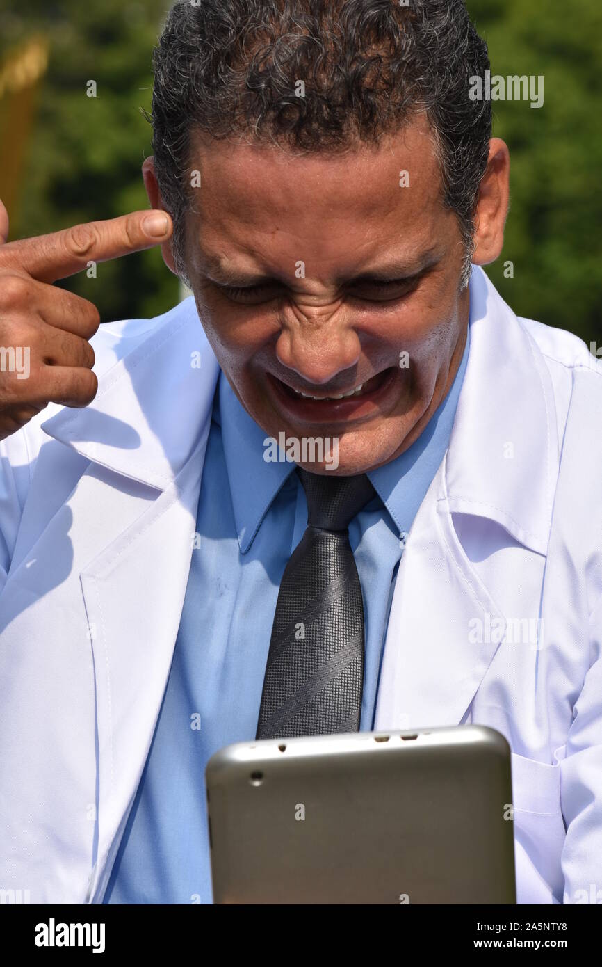 Stressed hispanic male doctor hi-res stock photography and images - Alamy