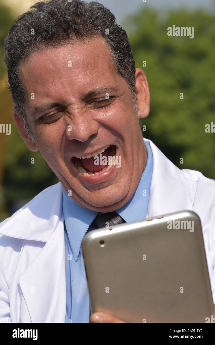 Happy hispanic male surgeon tablet hi-res stock photography and images ...