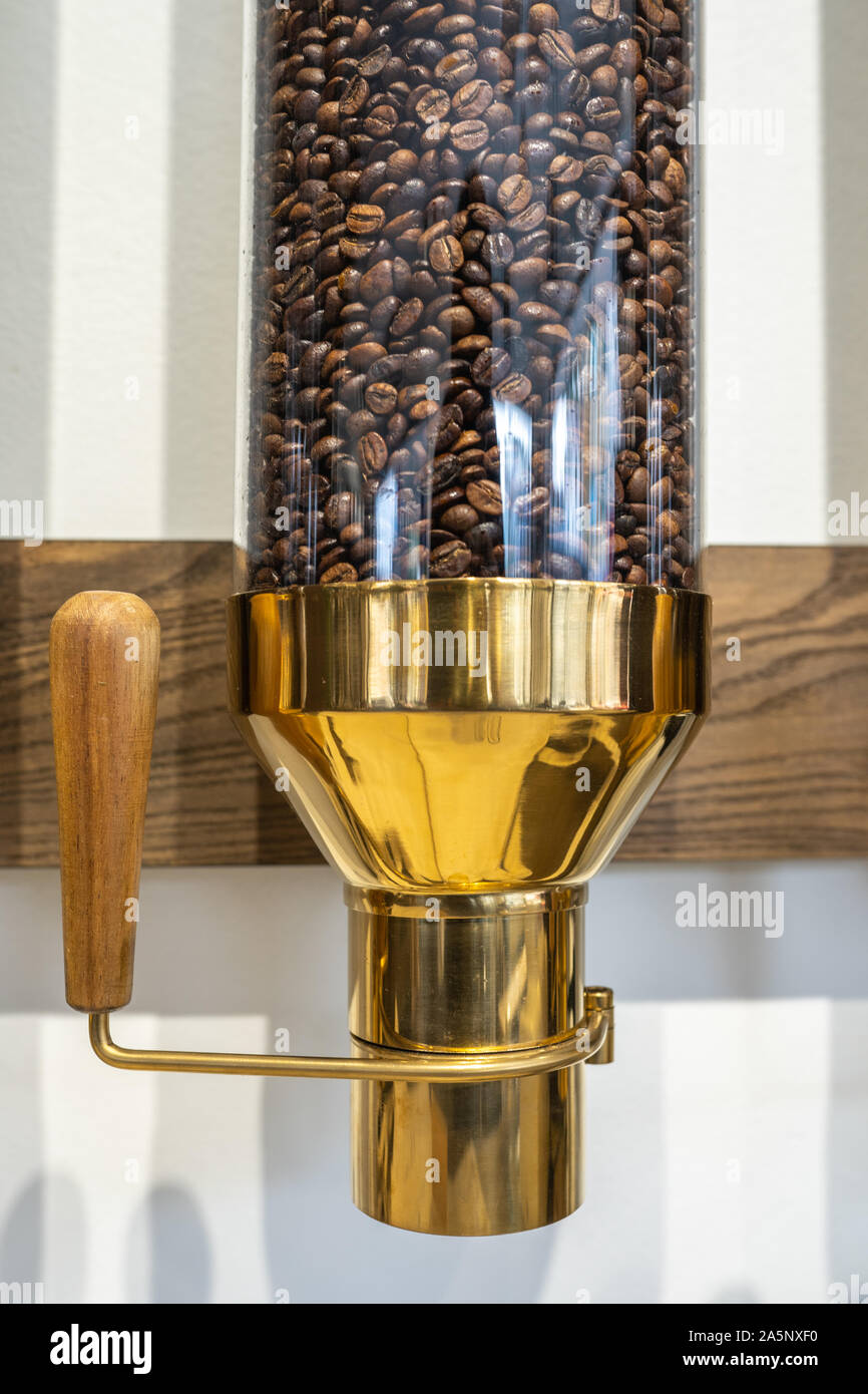 Closeup photo of fresh coffee beans contained within luxury dispenser Stock  Photo - Alamy