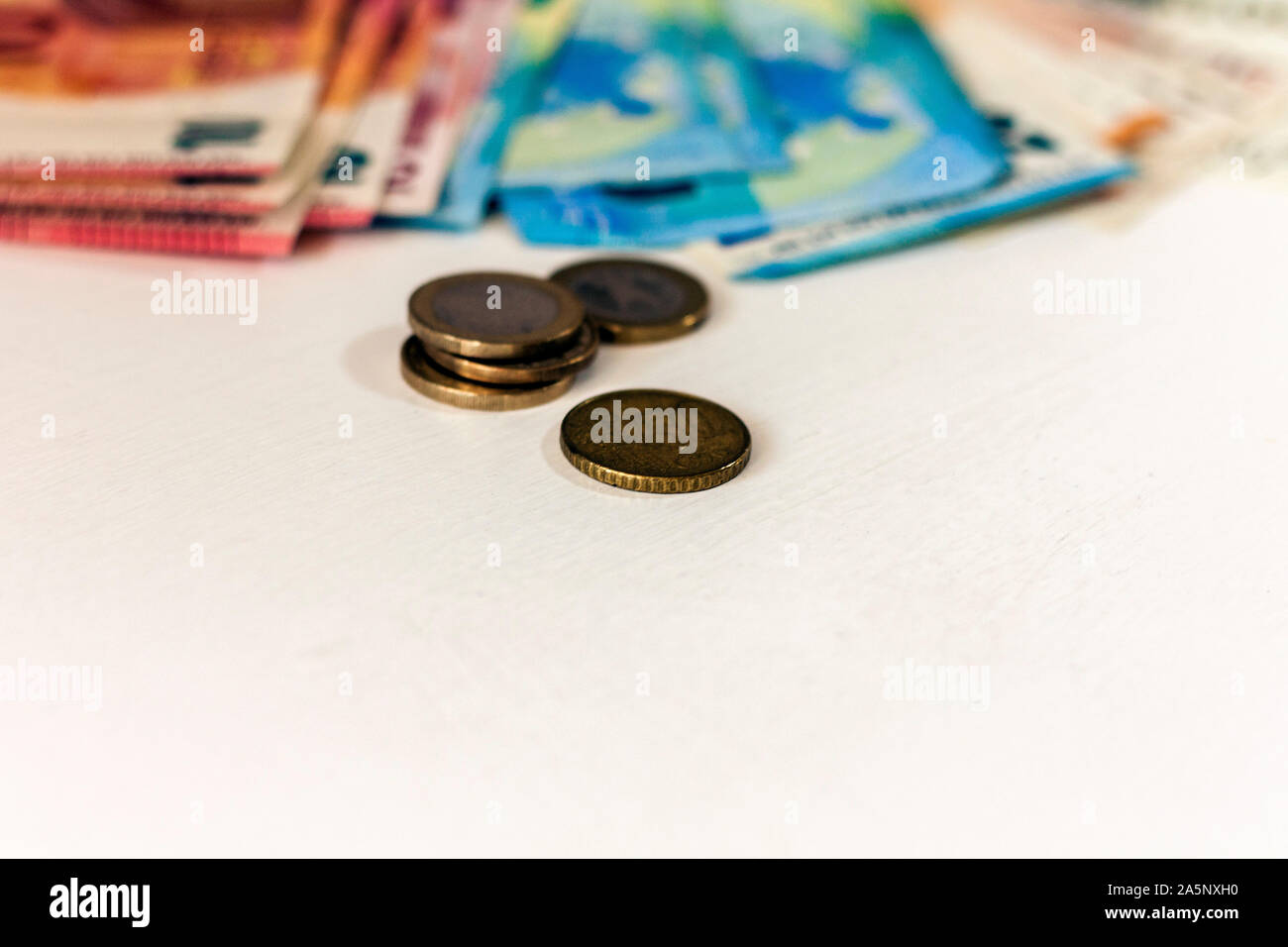 Close up money euro banknotes and coins on white background Stock Photo ...