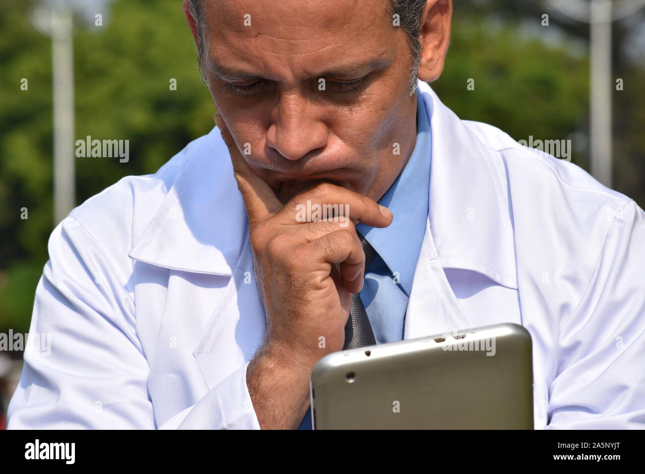 Confused male hispanic doctor hi-res stock photography and images - Alamy