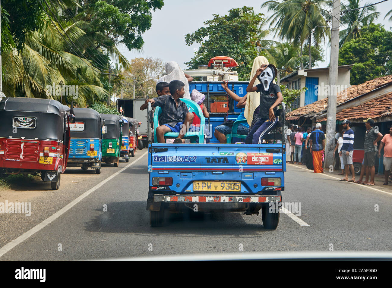 Sri Lankan kids mucking around on back of pickup truck Stock Photo
