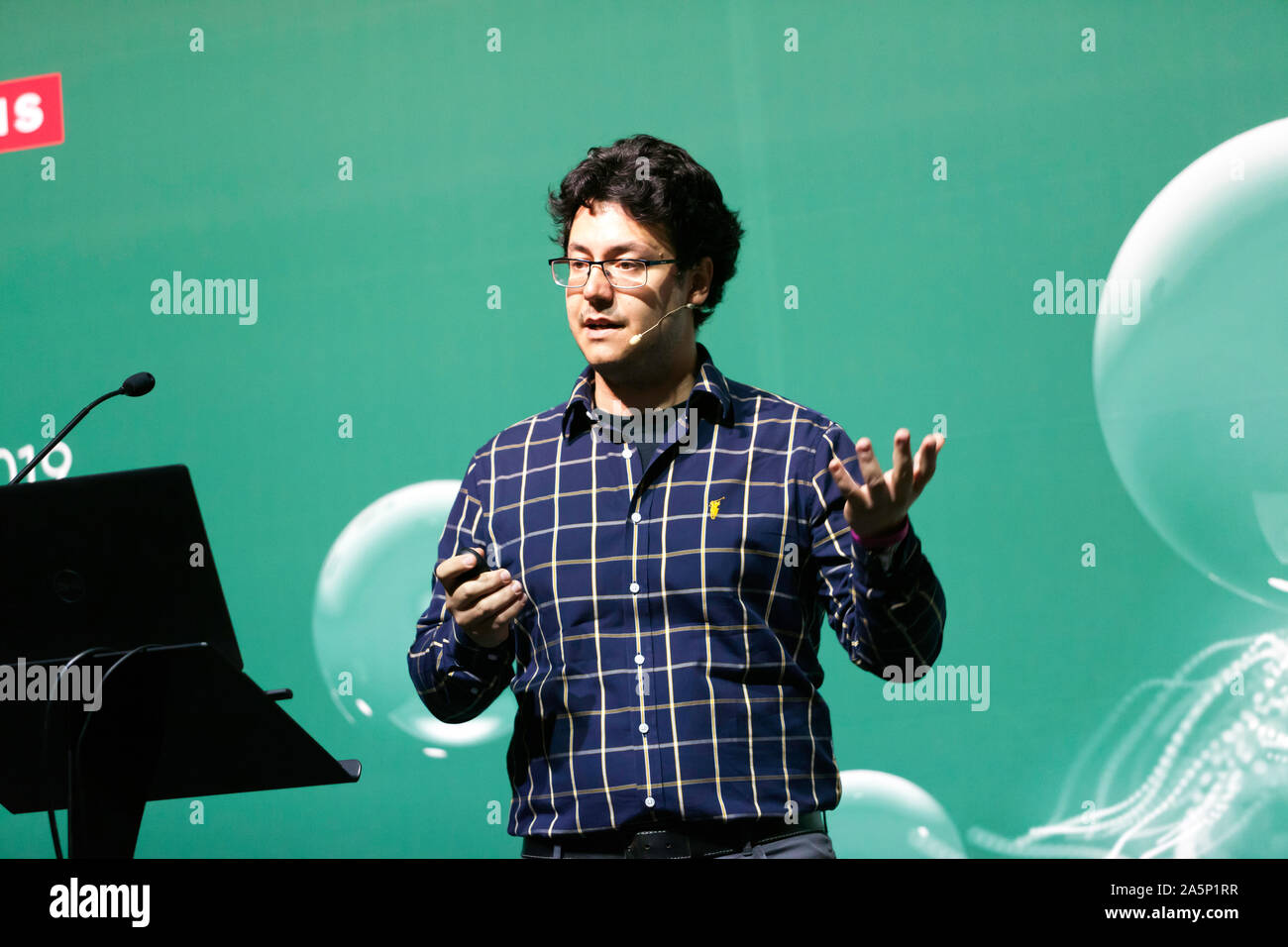 Christos Bergeles, Senior lecturer at  King's College London,  explaining how micro-robotics can be used to help cure blindness, On the Technology Stage at New Scientist Live 2019 Stock Photo