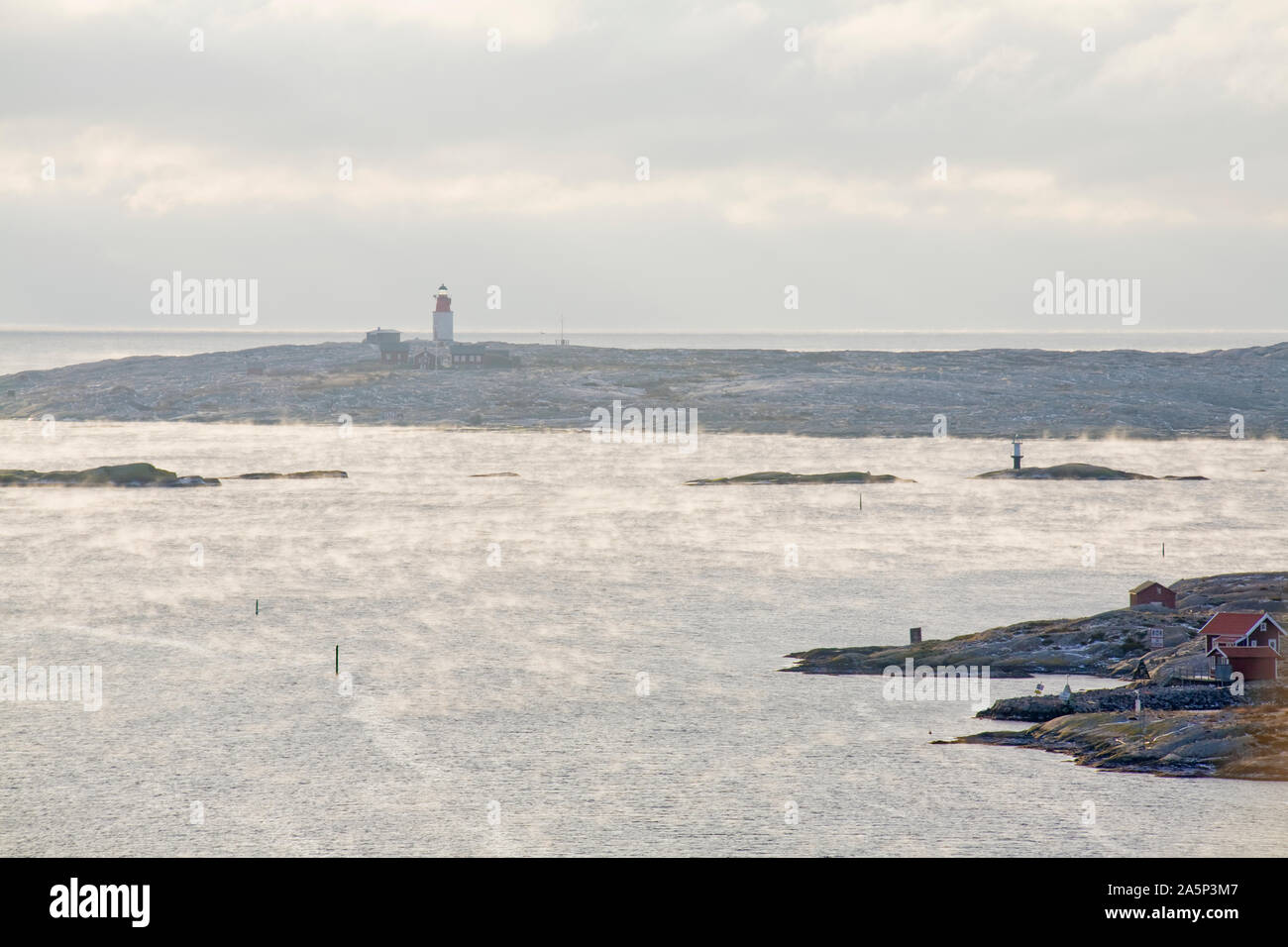 View of sea coast with lighthouse Stock Photo