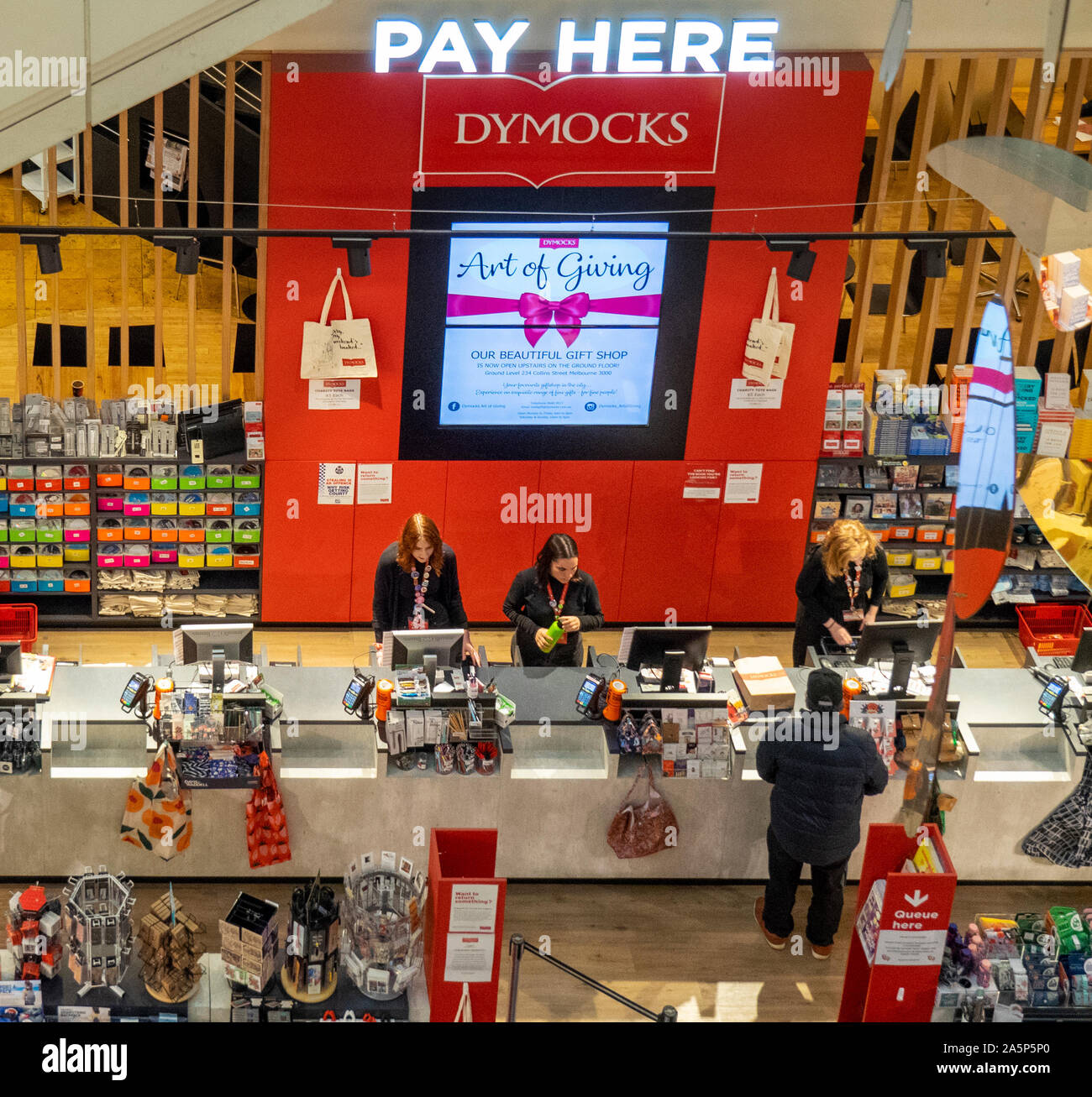 A man purchasing books at a Dymocks bookstore Stock Photo Alamy