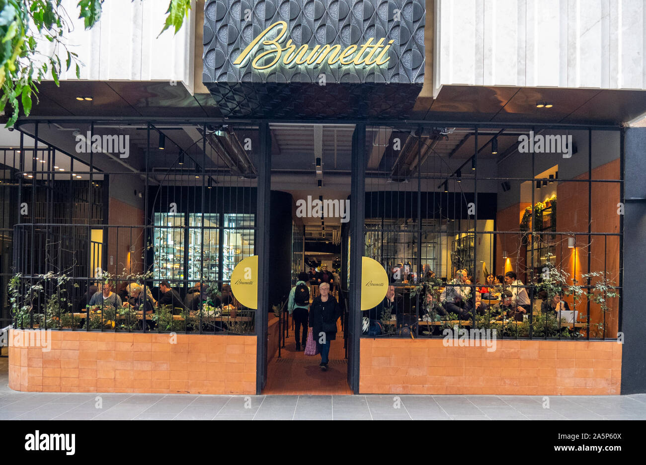 A woman exiting Restaurant on Flinders lane Melbourne