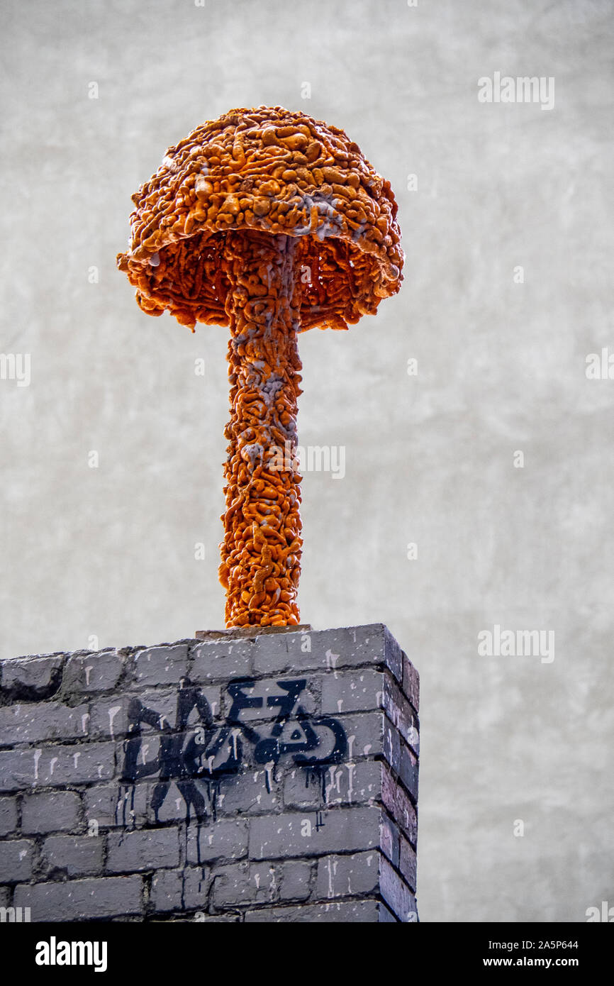 Mushroom or toadstool sculpture  on a brick wall in Hosier Lane Melbourne Victoria Australia. Stock Photo