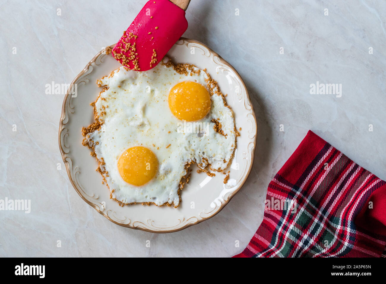 Sesame Seeds with Fried Eggs for Breakfast. Organic Food Stock Photo