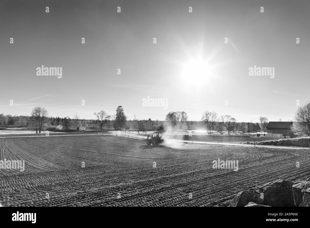 Tractor on field Stock Photo - Alamy