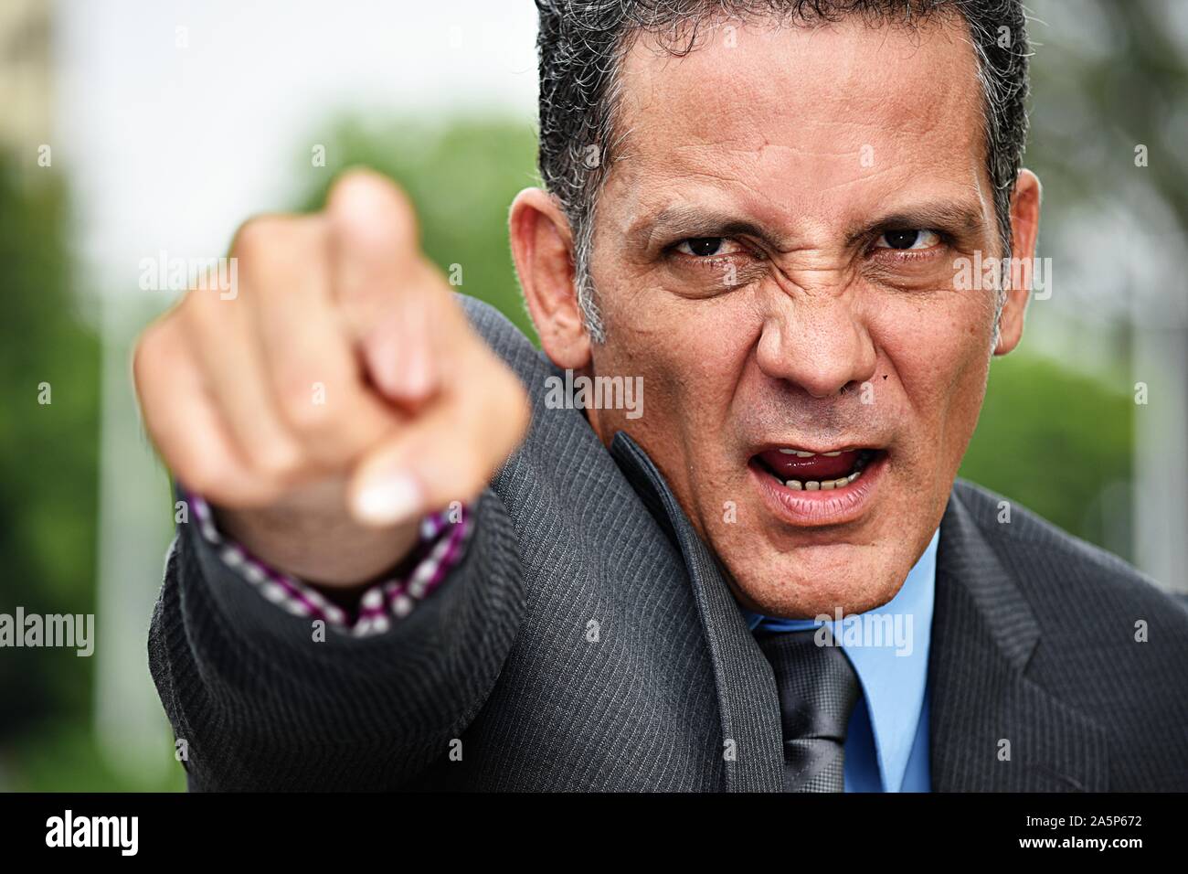 Colombian Business Executive Pointing Wearing Suit Stock Photo - Alamy