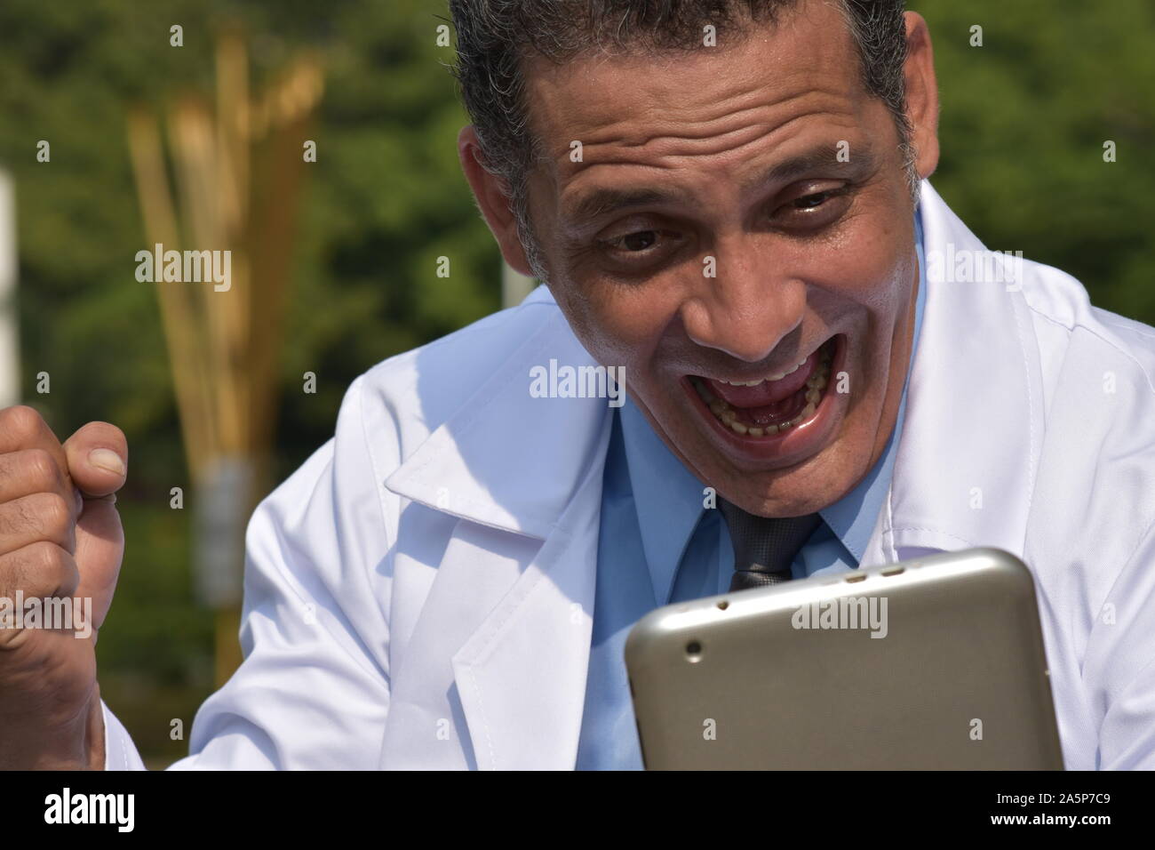 Happy hispanic male surgeon tablet hi-res stock photography and images ...