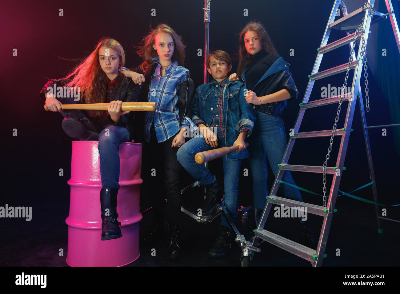 Rebel youth. Full length portrait of cocky children in stylish jeans and  leather clothes. Concept of teenage riot, kids fashion, nonconformism and  young energy. Modern lifestyle Stock Photo - Alamy