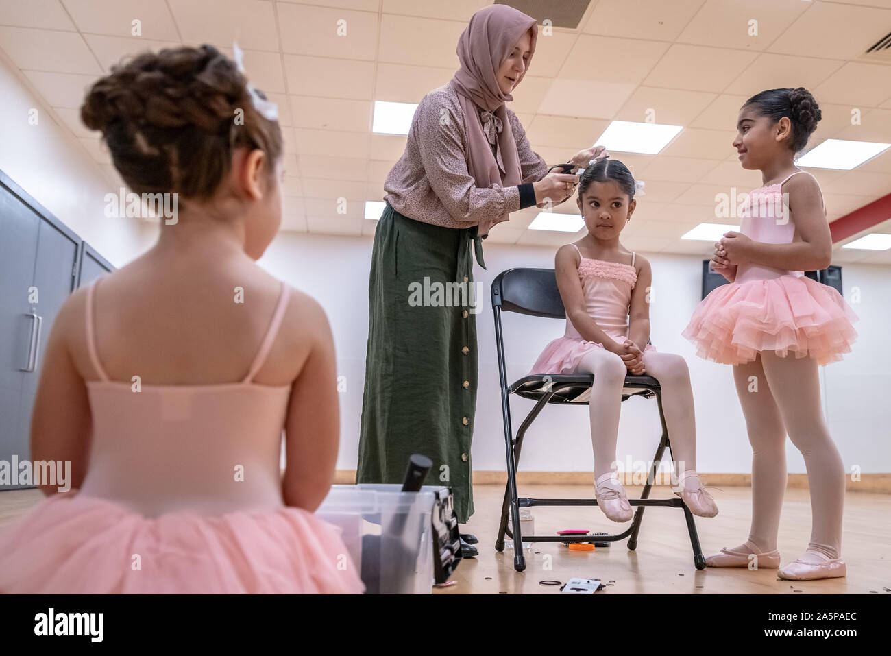 London, UK. 22nd Oct, 2019. World Ballet Day: Muslim Ballet School. Grace & Poise Academy. Founded in Jan 2019 by Maisie Alexandra Byers(pictured), a graduate of the Royal Academy of Dance and Dr Sajedah Shabib, business director, Grace & Poise Academy is the world’s first ballet school bringing ballet to the Muslim community.  Young dancers pictured: Marym 4yrs, Halimah 4yrs and Evi 5yrs Credit: Guy Corbishley/Alamy Live News Stock Photo