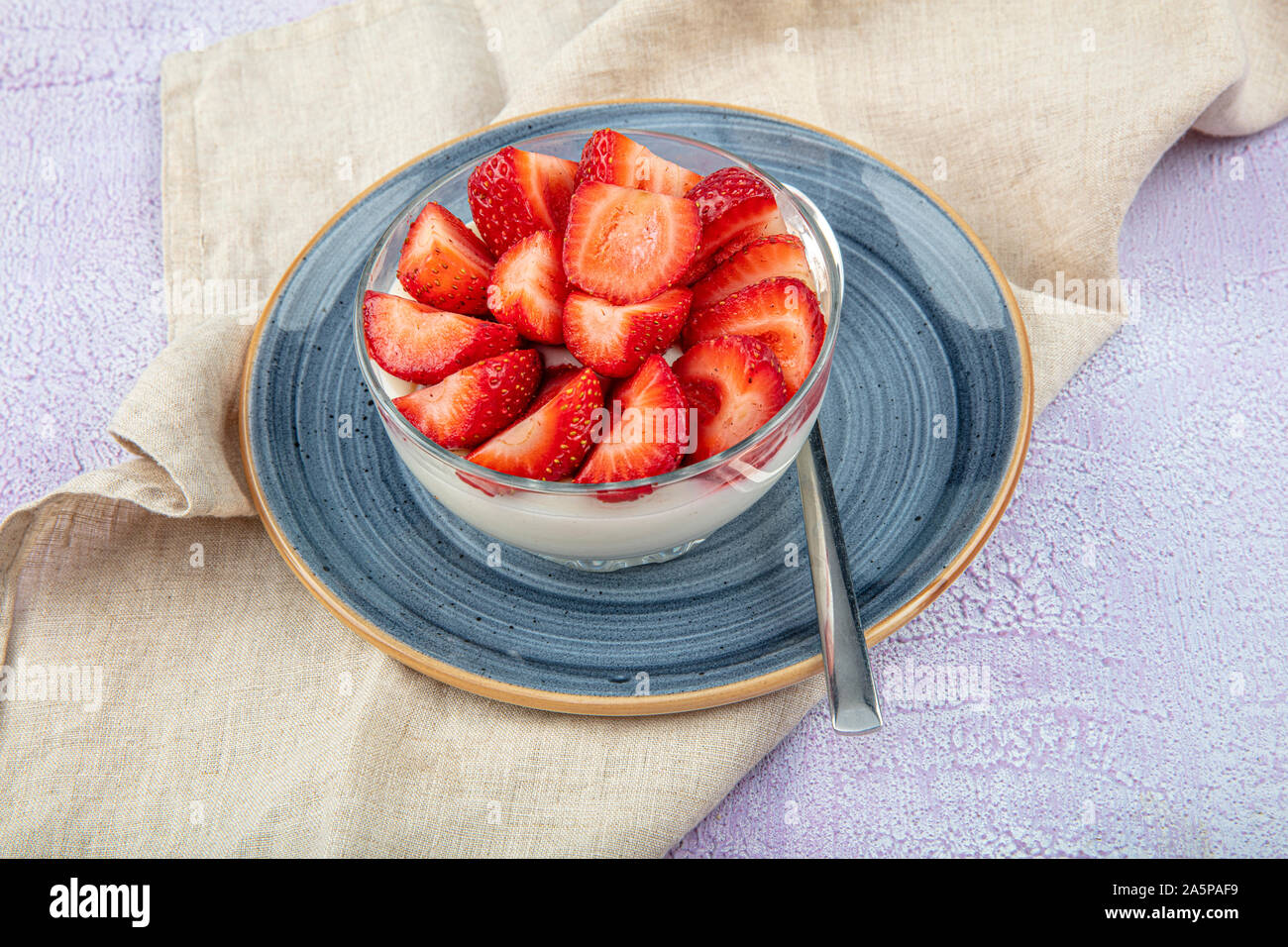 Strawberry Custard, Pudding with strawberry over wooden background. Stock Photo