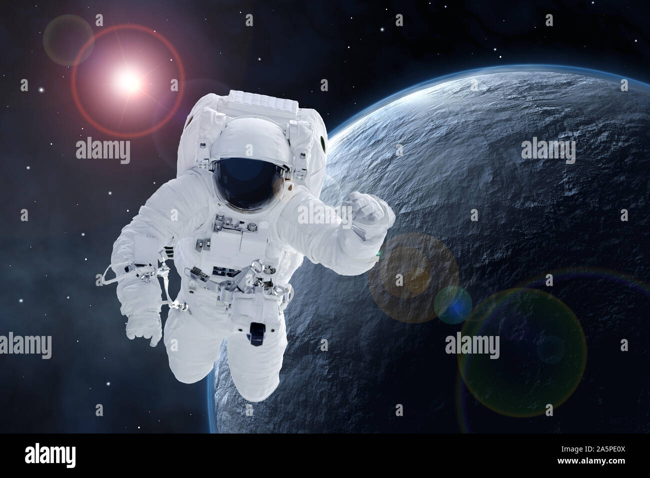 Astronaut over a potentially habitable planet. Elements of this image were furnished by NASA. Stock Photo