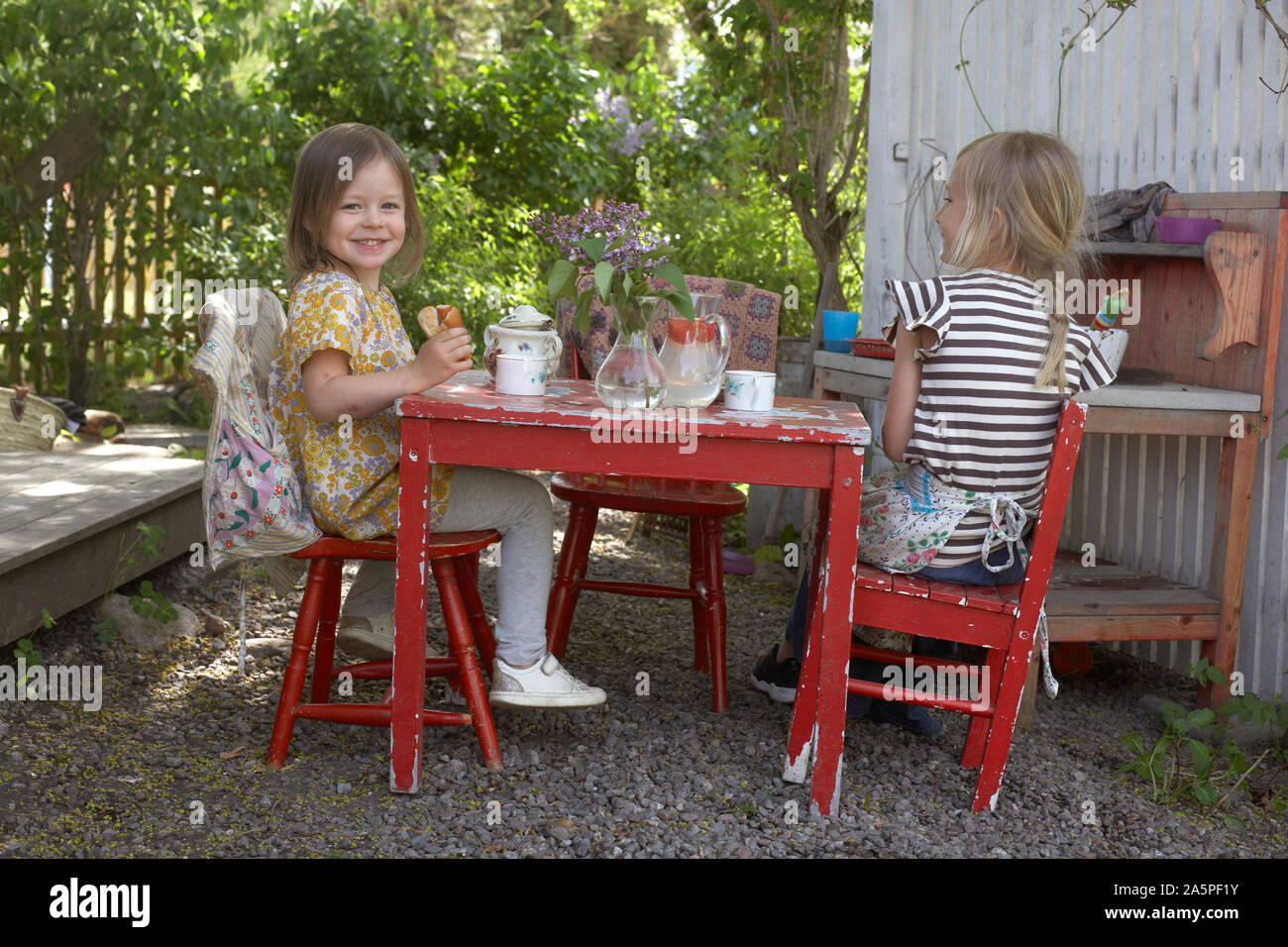 Two girls having tea hi-res stock photography and images - Alamy