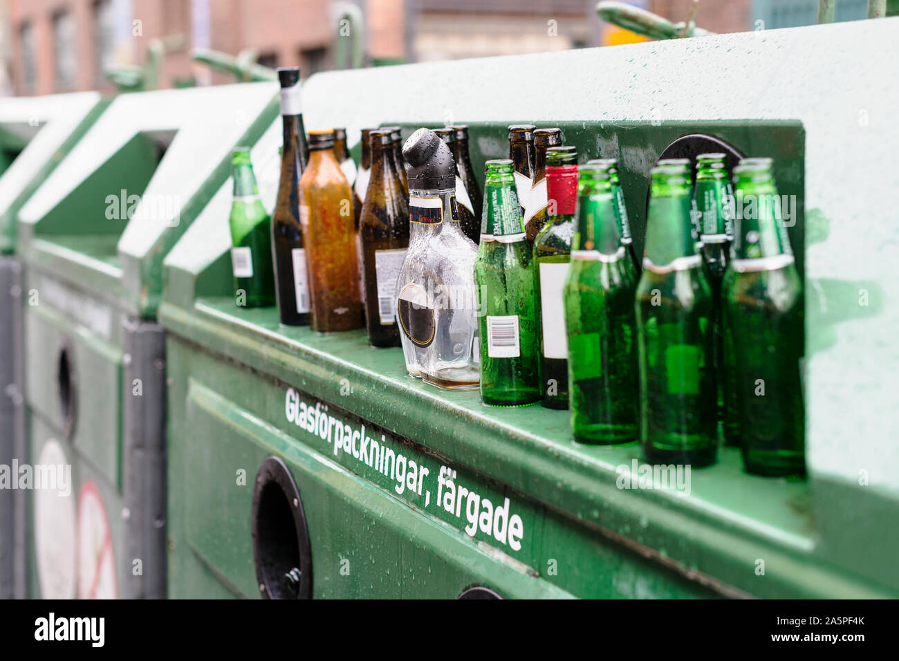 Empty bottles on recycling bin Stock Photo - Alamy