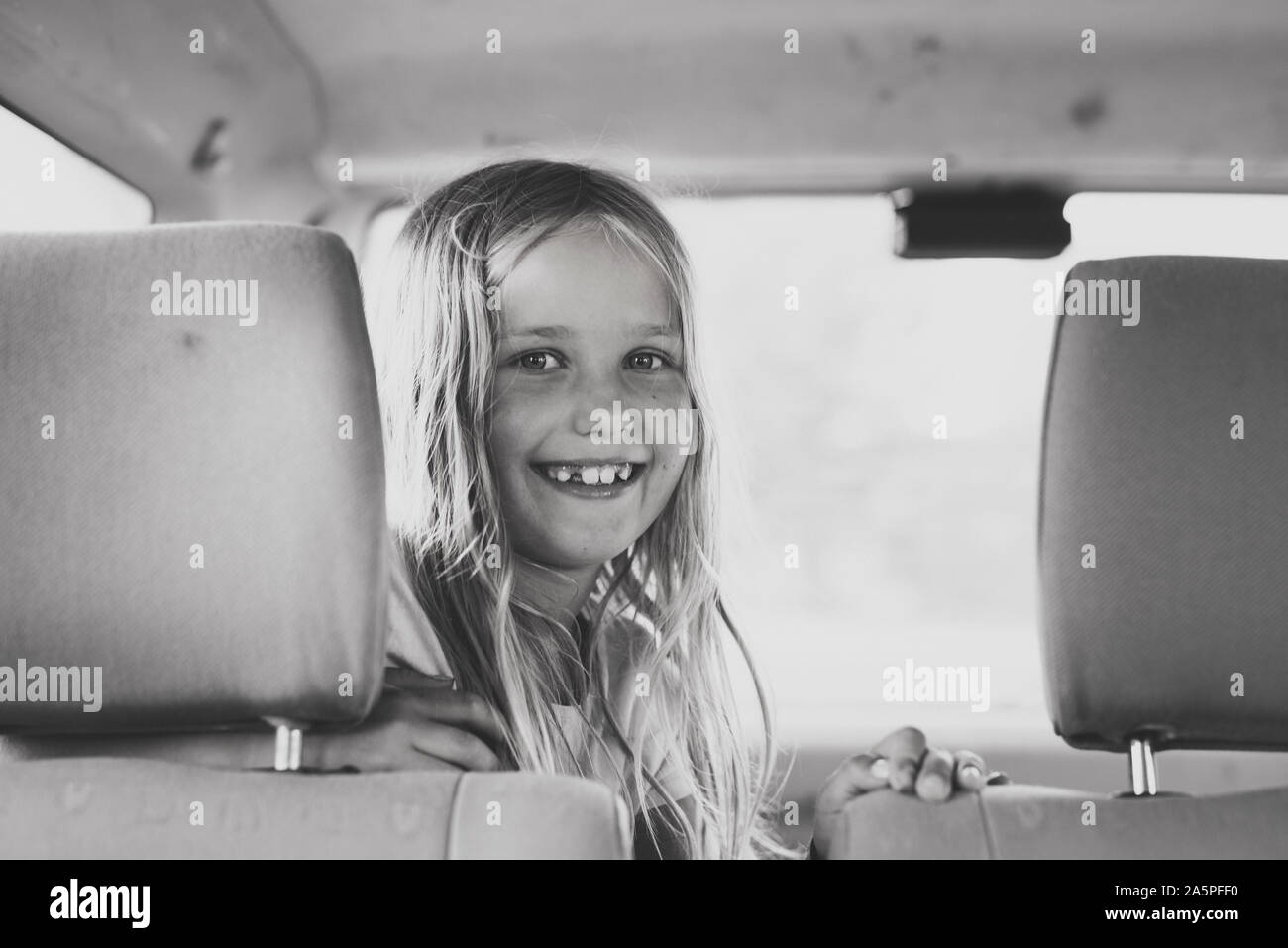 Smiling girl in car Stock Photo