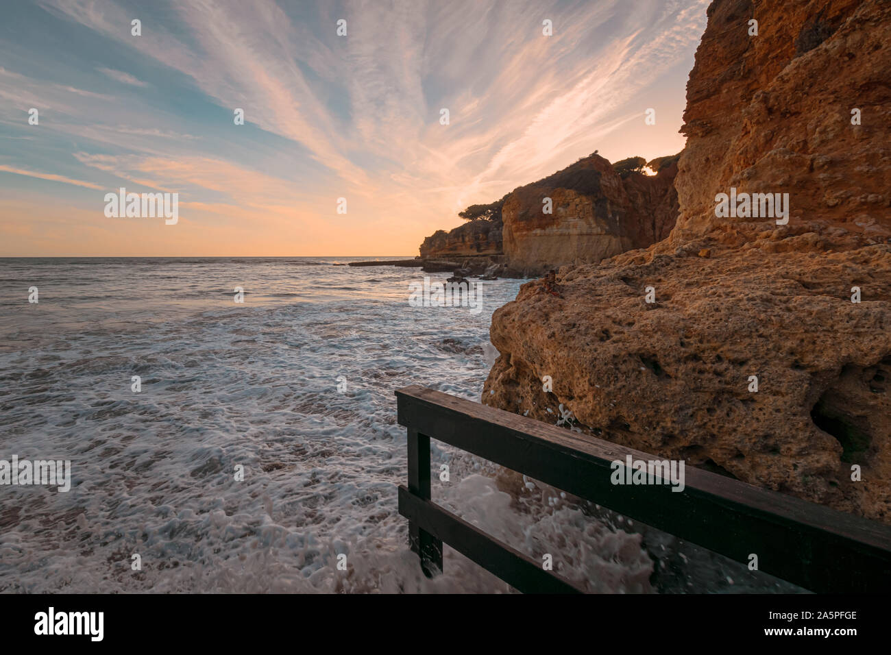High tide at the beach at Olhos D'Agua in the Algarve on the south coast of Portugal. Stock Photo