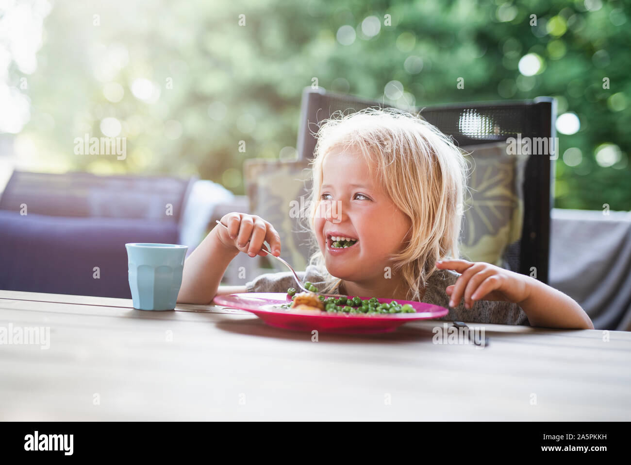 Girl at table Stock Photo