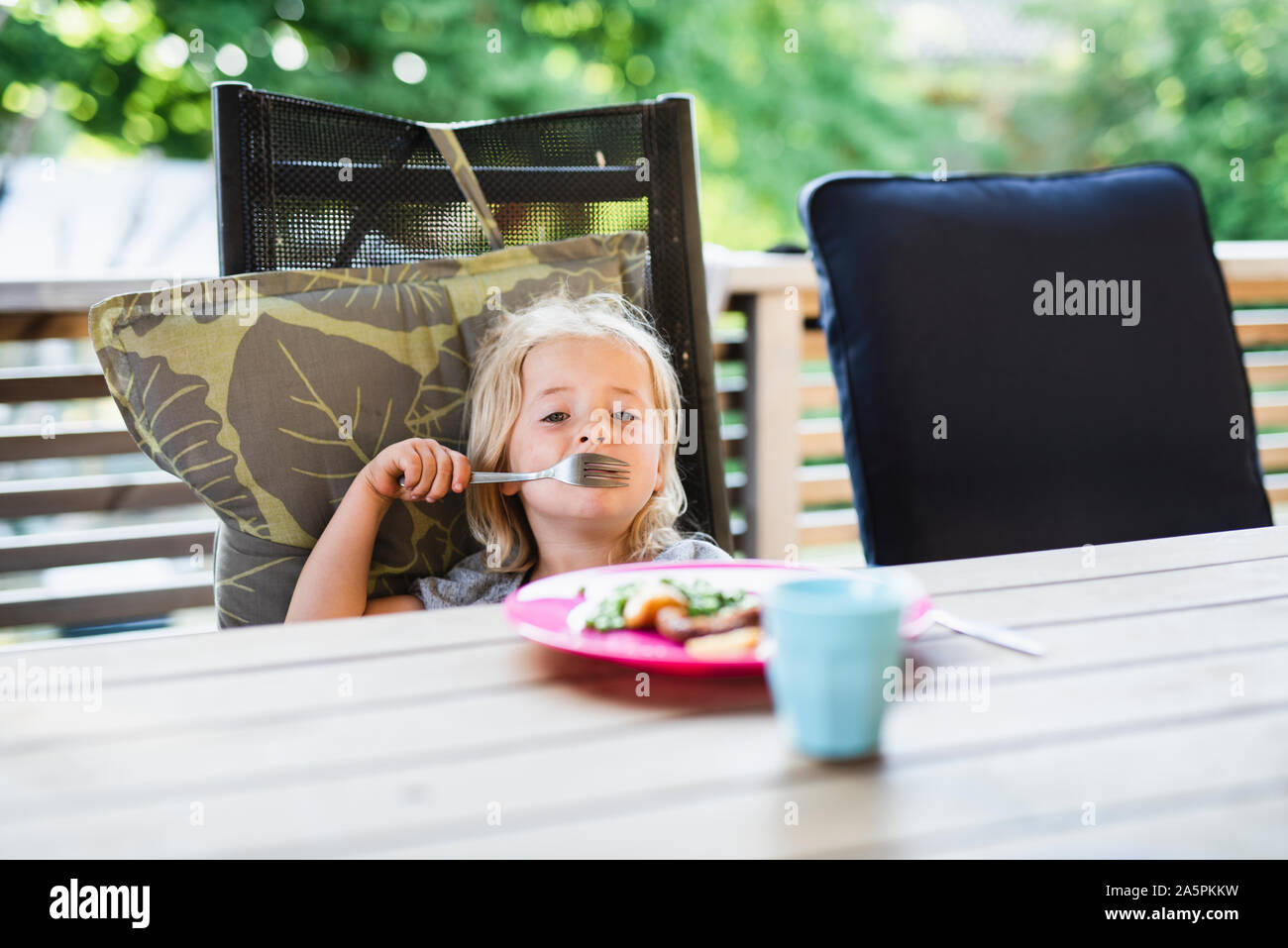 Girl at table Stock Photo