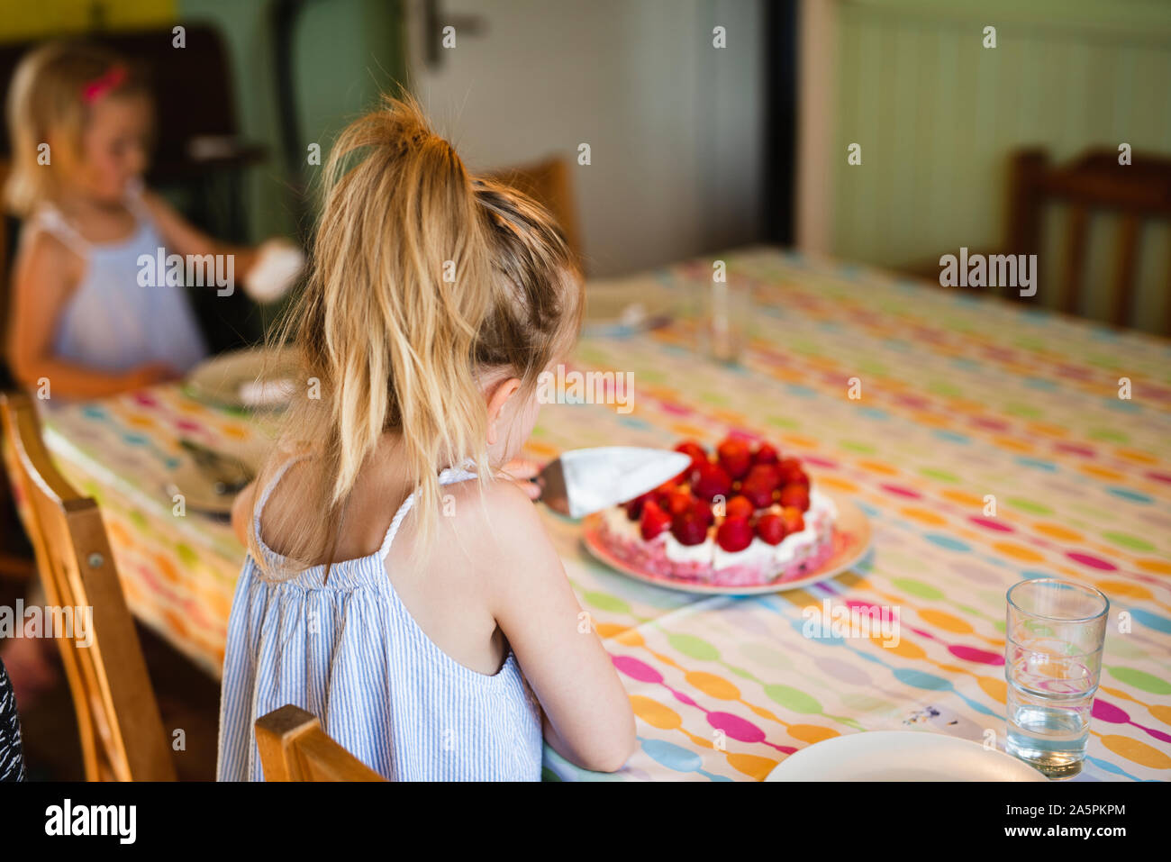 Girl at table Stock Photo