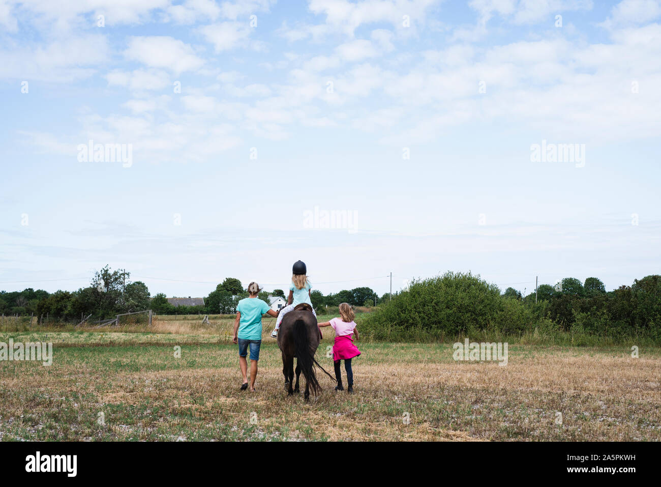 Girl horseback riding Stock Photo