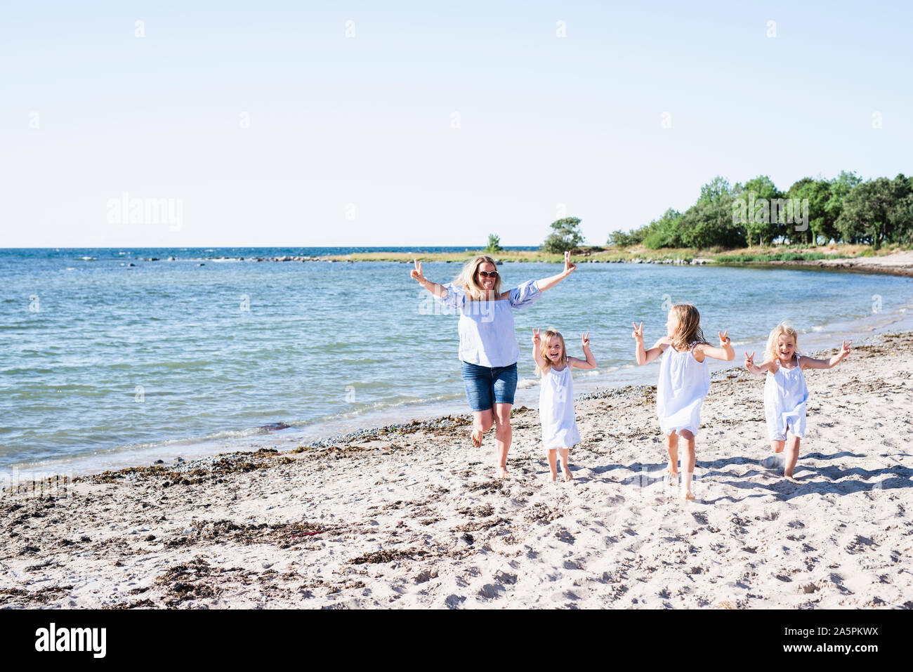 Family on beach Stock Photo