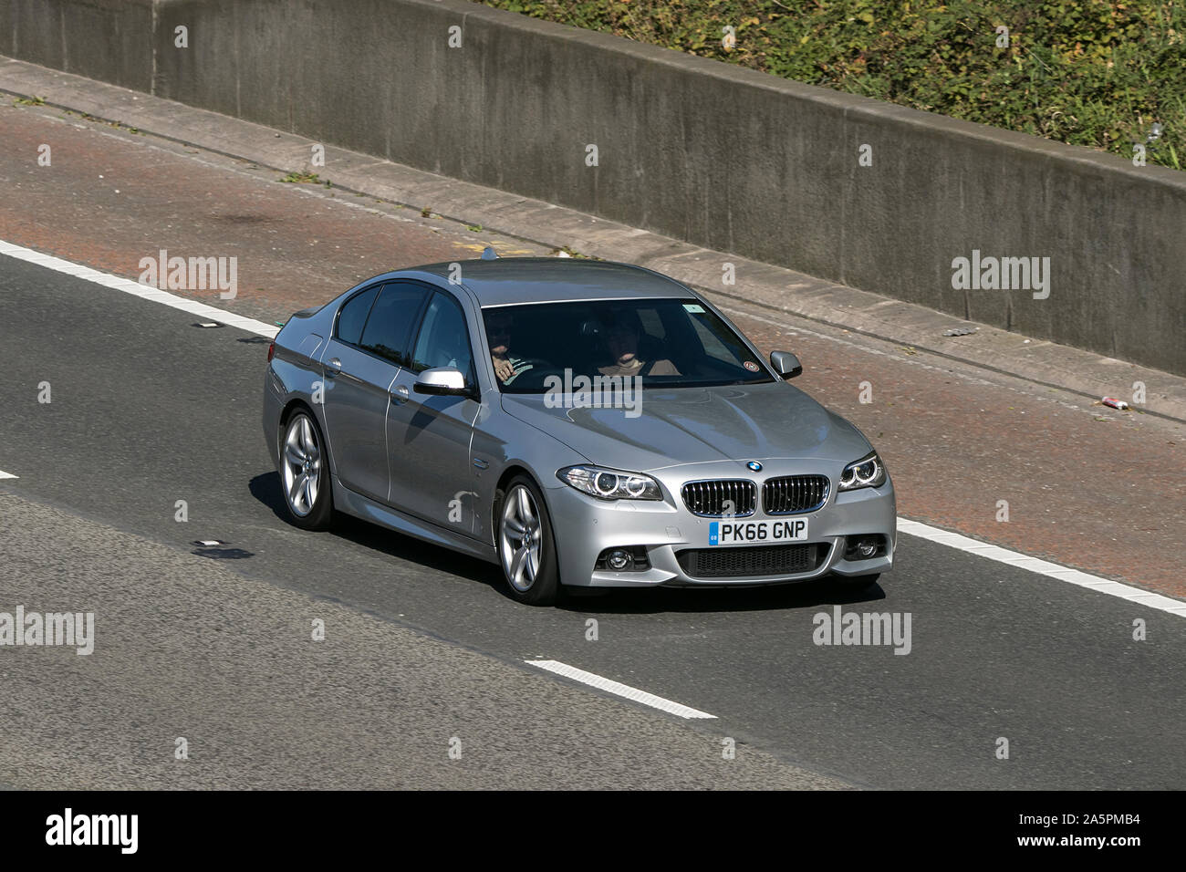2016 silver BMW 520D M Sport Auto; Vehicle travelling on the M6 motorway near Preston in Lancashire, UK Stock Photo