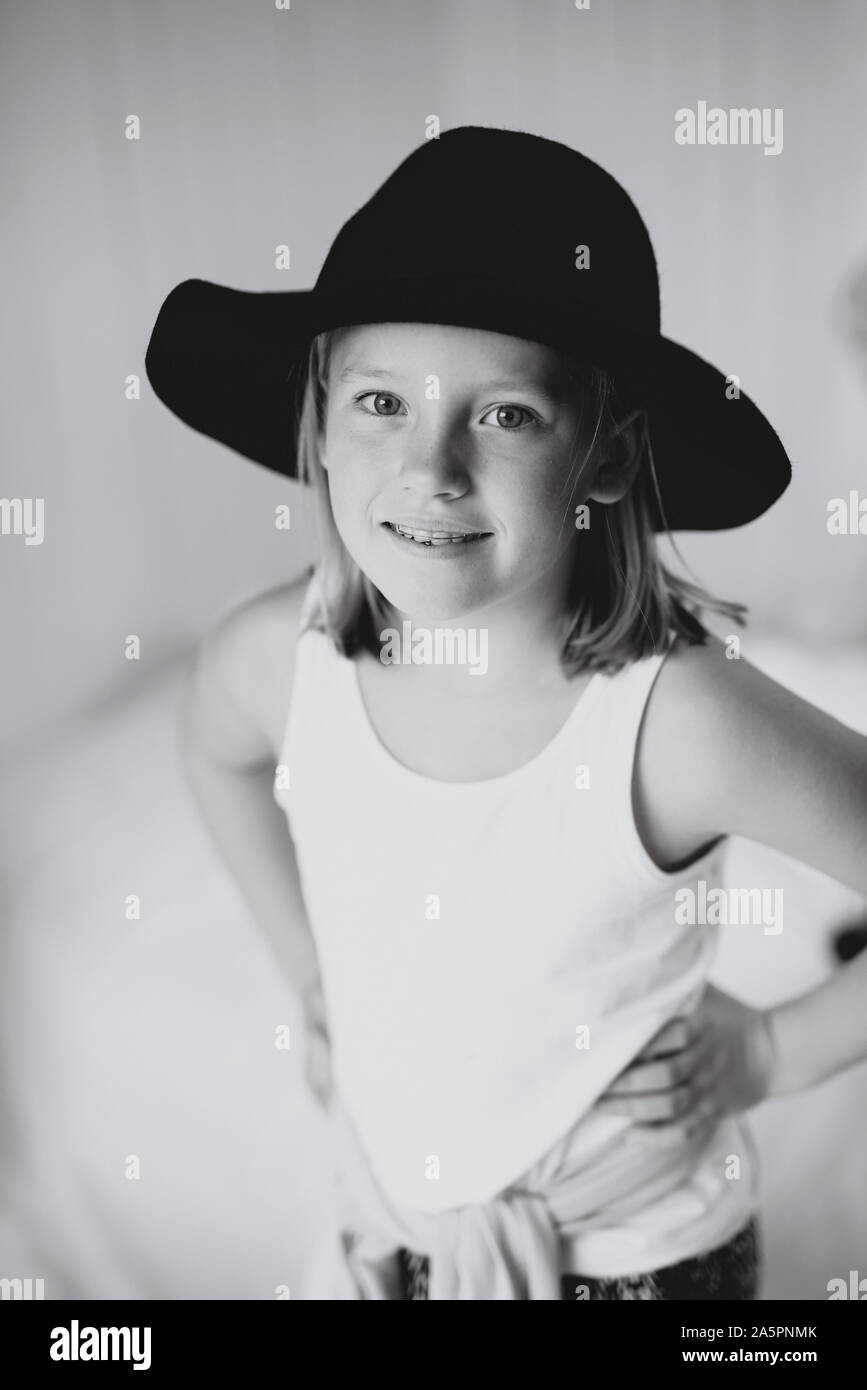 Smiling blonde girl wearing hat Stock Photo