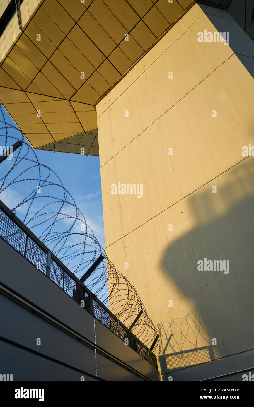 Barbed wire on top of wall Stock Photo - Alamy