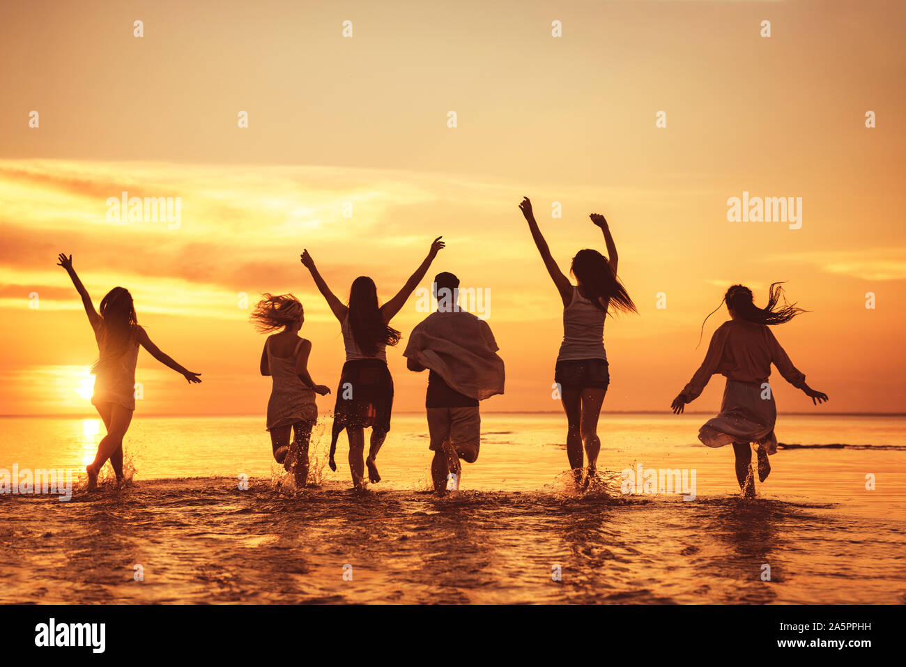 Big group of happy young friends is having fun at sunset beach party Stock Photo Alamy