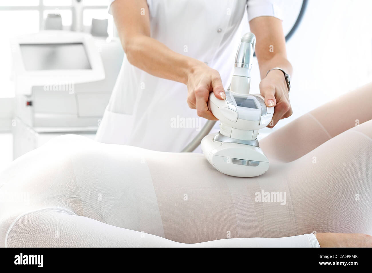 Vacuum massage. Endermology, abdominal vacuum massage. A woman's body  during a care treatment Stock Photo - Alamy