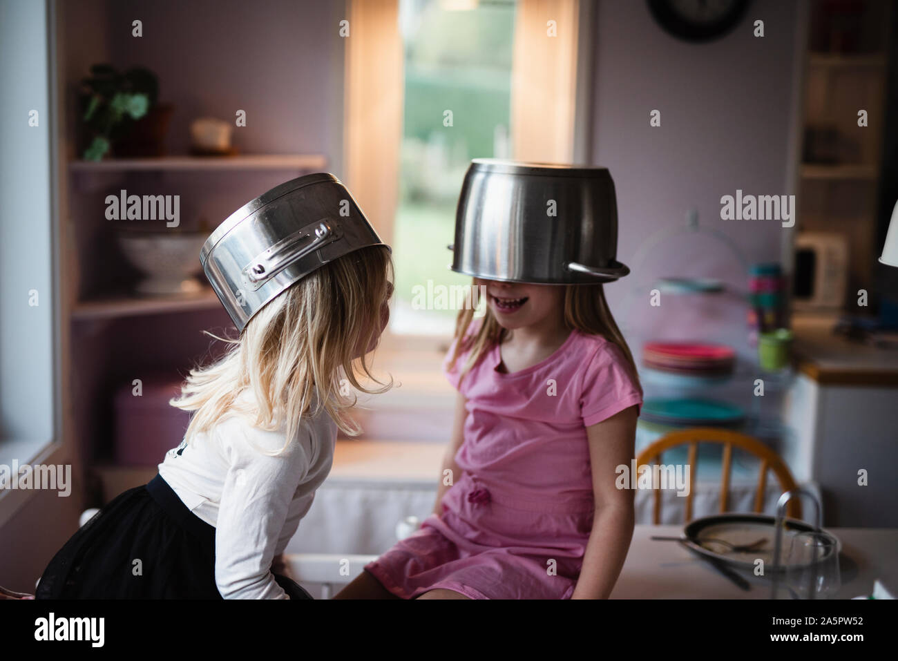 Girls wearing pots Stock Photo Alamy