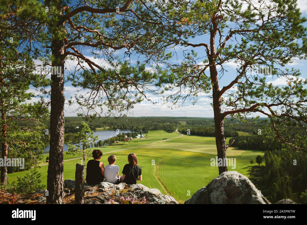 Boys sitting on rock river hi-res stock photography and images - Alamy